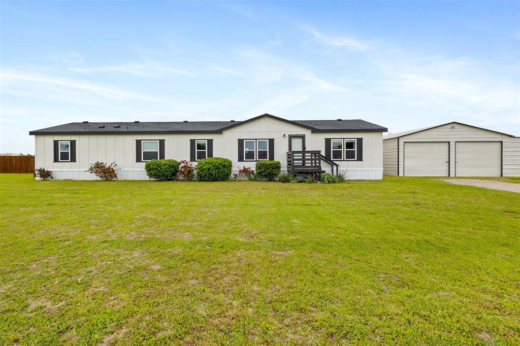 Welcome to your slice of Texas charm in Justin! Sitting on a full acre, this beautifully updated property offers the space, flexibility, and features everyone is searching for—located in highly sought-after Ponder ISD.Inside, you’ll find 5 spacious bedrooms and 3 full baths, giving you plenty of room for family, guests, a home office—or all of the above. The updates throughout bring a fresh, modern feel while still keeping that warm, inviting vibe. Natural light fills the home, and the layout flows easily for both everyday living and entertaining.Step outside and enjoy true Texas living. With a full acre to spread out, there’s room for animals, gatherings, and wide-open skies. The fully fenced backyard is perfect for kids, pets, or simply enjoying your own private space. The standout feature? A shop with electricity—ideal for hobbies, storage, a workspace, or your next big project.Located in Justin, you get that peaceful country feel while still being conveniently close to town, dining, and schools—all within Ponder ISD.Space, updates, acreage, a shop, and a fenced yard….this one truly checks all the boxes.