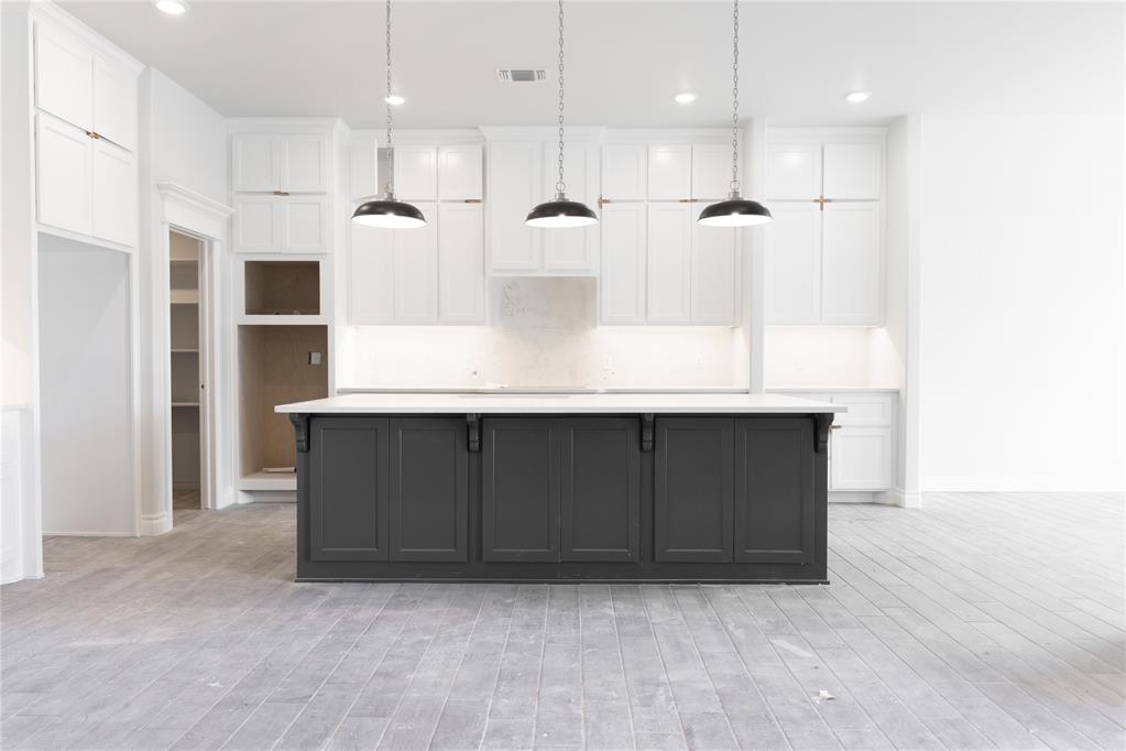 This Korbyn Bonus Room floor plan includes 3,895 Sq Ft of total living space, which includes 3,625 Sq Ft of indoor living space and 270 of outdoor living space. There is also a 690 Sq Ft, three-car garage with a storm shelter installed. This truly spectacular home offers 5 sizeable bedrooms, 4 full bathrooms, a half bath, 2 covered patios, an In-Law/guest suite, a mud area, a utility room featuring a utility sink, and a generous bonus room. Pass the covered front porch and the dual height entry lies the ultimate floor plan. The great room embraces wood-look tile, a spectacular cathedral ceiling with a crows feet detail, a ceiling fan, a luxurious 3-panel sliding door with a 4' back patio extension, and a center gas fireplace surrounded by our stacked stone detail. The great room opens to the kitchen, which boasts an oversized center island with a trash can pullout, custom-built cabinets to the ceiling, 3 CM countertops, a HUGE walk-in pantry, stainless steel appliances, including double ovens and a 5-burner cooktop, adorning tile backsplash, stunning pendant lighting, and ample storage opportunities. The secluded primary suite features windows, our cozy carpet finish, a ceiling fan, and our sloped ceiling detail. The outstanding primary bath features a European walk-in shower, a separate sink vanity concept, a free-standing tub, a private water closet, & TWO primary walk-in closets. Bedroom #2 lies towards the front of the home and spotlights an In-Law/guest suite set up with a walk-in closet included. The second level holds the generous bonus room, a full bath, a Jack and Jill bathroom set up, and bedrooms #3, #4, and #5. Outdoor living proudly supports a corner wood-burning fireplace, a gas line for your grill, and a TV hookup. Other amenities for this stellar home include a tankless water heater, an air filtration system, a fresh air ventilation system, and so much more!