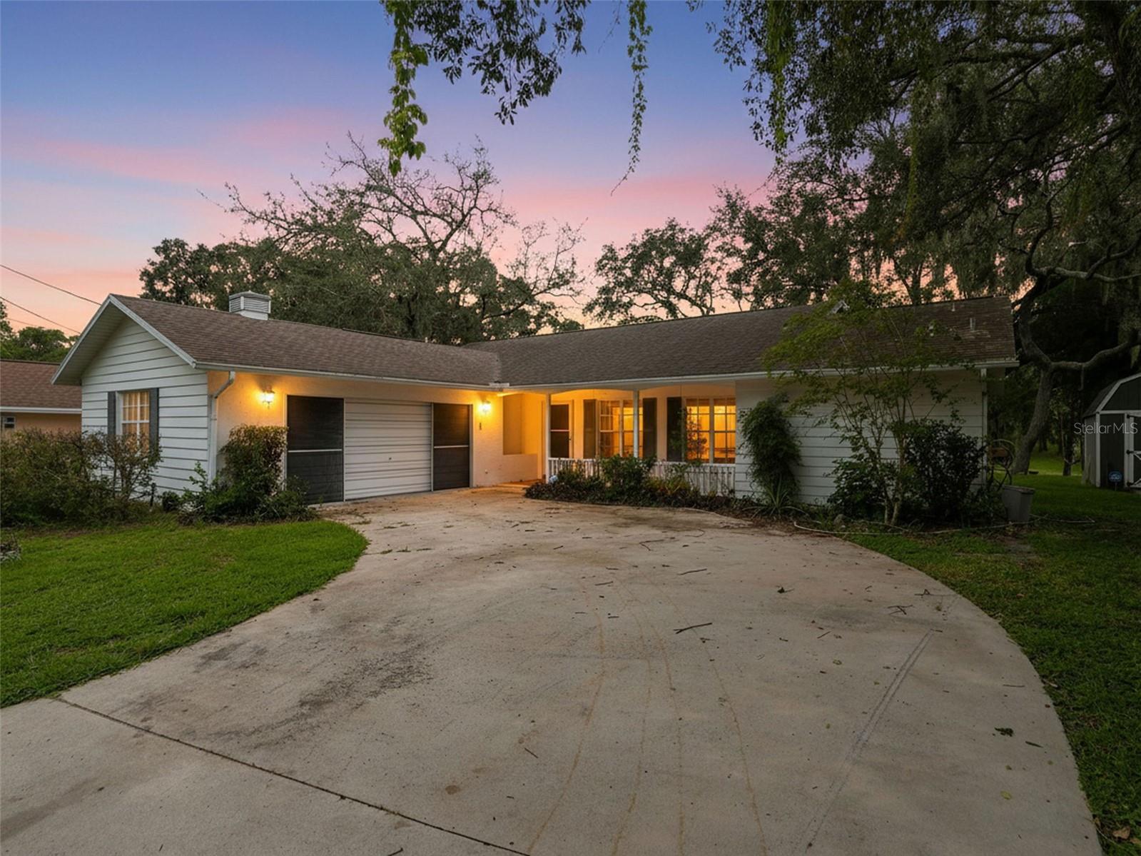 INCREDIBLE BACKYARD!! 3 bedrooms + 2 bathrooms + 2 garage + gorgeous mature grandfather oaks overlooking a pond with no rear neighbors! Remodeled Kitchen with white cabinets, granite countertops, and stainless steel appliances.  High ceilings and pocketing glass slides make this home feel light, bright, and spacious! Charming front porch! Large rear lanai to enjoy your beautiful backyard! Split floor plan offers privacy for the master suite! Laundry room has a laundry tub.  NO HOA!Close to everything!! Shoppes, restaurants, hospitals, schools...everything!! Less than 10 minutes to kayaking, paddle-boarding, and swimming with the manatees in the clear Weeki Wachee River or enjoying a day at Buccaneer Bay Water Park!! 15 minutes to the sunsets at Pine Island, boating and fishing!! Less than 10 minutes to the Suncoast Parkway for quick and easy access to Tampa International Airport and for all the fun that Tampa Bay has to offer!! 1 hour + to TOP US BEACHES!! 1.5 hours to Disney World and Universal Studios and all the theme parks!!