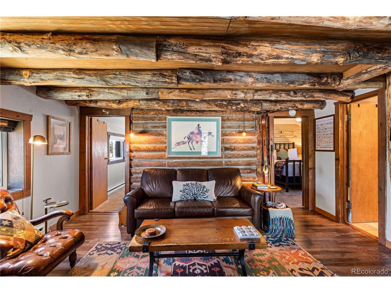 Discover authentic mountain living from this well-appointed, classic log cabin in historic Fairplay. This charming home is close to skiing, sold fully furnished, and offers flexible rental income potential. Rustic features including log truss ceilings and a river rock hearth bring quintessential cabin charm, while a comfortable floorpan features 2 bedrooms, an updated bathroom, and a finished loft. With a flat, corner lot, 14er mountain views, and coveted short-term rental license availability, this versatile property is a great fit for those looking for a weekend getaway in the mountains, local first-time homebuyers, and Airbnb rental investors. An impressive list of recent capital improvements includes new composite decking, fresh exterior stain, new hot water heater, and new windows, doors, and trim. Enjoy outdoor living and big alpine vistas from the sunny deck and fenced-in yard. A large shed offers plenty of storage for all your toys. The cabin has no HOA, no transfer tax, and is a proven vacation rental producing $35k-$40k in gross annual income. Surrounded by some of the highest peaks in Colorado, Fairplay is an outdoor-lover's paradise. This is the perfect basecamp for adventures in all seasons, with easy access to world-class skiing, mountain biking, hiking, fly-fishing, river running, and powersports. Discover the shops, restaurants, National Forest trails, and museums of South Park's historic downtown - all only a short walk or bike from your front door. 22 mi to Breckenridge, 37 mi to Buena Vista. Set up a private viewing to see this welcoming and immaculately maintained cabin today, and embrace Colorado living at its finest.