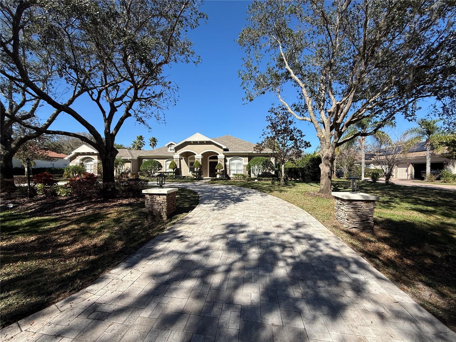 Prime Keystone Shores masterpiece featuring gated entry, majestic oaks and mature queen palms cover this private estate. Wood, gas, and electric fireplace setting the ambiance and keeping you cozy every winter.  Pool with spillover jacuzzi. Natural light. Quartz countertops, Subzero and Wolf appliances. Country paradise awaits.-New Trane A/C 2025-New Kohler toilets 2025-New/ Updated Paint-2025-New LED Garage lighting -2025-New variable speed pool pump -2025-New exterior hose bibs -2025-New whole home water filtration -2025-Under sink RO drinking water filtration -2024