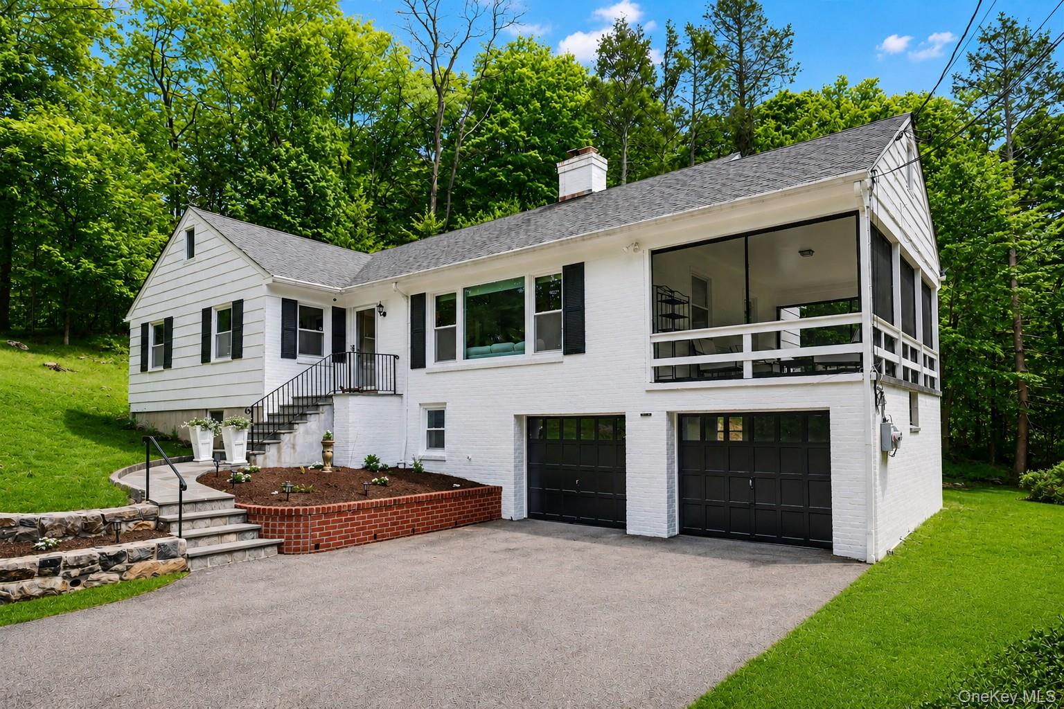 Some homes offer space. Others offer a feeling.Tucked along a picturesque tree lined street in the sought after Dodge Farm section of Chappaqua, 28 Valley View Road is a place where privacy, comfort and timeless charm come together beautifully.Privately sited on approximately 1.2 acres, framed by beautiful landscaping, mature plantings and striking stone walls, this thoughtfully designed 3 bedroom, 2 bath home offers a wonderful layout designed for everyday living and effortless entertaining.Step inside to a warm and inviting living room anchored by a wood burning fireplace, flowing seamlessly into the dining area to create comfortable gathering spaces filled with natural light and connection.One of the home's standout features is the expansive screened porch offering nearly 300 square feet of additional enjoyment, creating a seamless extension of the interior living experience. Rainy evening dinners, game nights with friends, quiet mornings with coffee or simply unwinding with a good book become moments to savor while surrounded by peaceful outdoor views. Designed for enjoyment through multiple seasons, this exceptional space brings the beauty of the outdoors closer to home.The kitchen offers timeless appeal with freshly painted solid wood cabinetry, granite countertops and a comfortable eat in area overlooking the backyard. Just outside, a private deck creates the perfect setting to enjoy morning coffee surrounded by mature landscaping and serene property views.The primary bedroom offers an ensuite bath and walk in closet, while two additional bedrooms provide flexibility for a variety of lifestyle needs.The finished walk out lower level adds over 400 square feet of versatile space featuring remarkable wide plank pine flooring reminiscent of craftsmanship rarely found today. Rich in character and warmth, the space lends itself beautifully to recreation, hobbies, workspace, fitness or gathering areas.An oversized attached two car garage offers excellent storage, while the walk up attic presents exciting possibilities for future expansion potential, offering flexibility for evolving needs.Located in the desirable Dogwood Farm area of Chappaqua, known for its peaceful setting while offering convenient access to local shopping, dining, parks, recreation and transportation options, this home presents a wonderful opportunity to enjoy space, privacy and timeless appeal in one of Northern Westchester's most sought after communities.A home designed not simply for living, but for enjoying life's quieter moments beautifully.