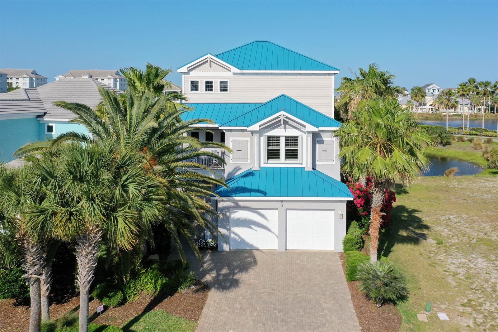 Cinnamon Beach, Ocean Hammock — Furnished, Elevator, Turnkey RentalThree stories of concrete-block construction, a private elevator, and water views from every level — this fully furnished 4-bedroom, 3 full, 2 1/2-bath residence in guard-gated Cinnamon Beach within Ocean Hammock is ready the day you close, whether as your coastal home or a proven short-term rental.This home offers unparalleled security and privacy with 24-hour manned entry. Designed for easy living and seamless entertaining, this concrete block masterpiece boasts 4 bedrooms and 3 full and 2 1/2 baths and an elevator for effortless access to all floors. Each level offers breathtaking views and a sense of tranquility, making it the perfect escape. Currently operating as a short-term rental, and owners retreat, this property presents a unique and lucrative opportunity for investors.  Its prime location provides quick and easy access to the ocean, allowing you to enjoy all the beauty and recreation of coastal living just steps from your front door.Ownership here includes Cinnamon Beach's oceanfront pool complex, clubhouse, fitness center, beach walkover and 24-hour manned gate, with Hammock Beach Resort just minutes away.