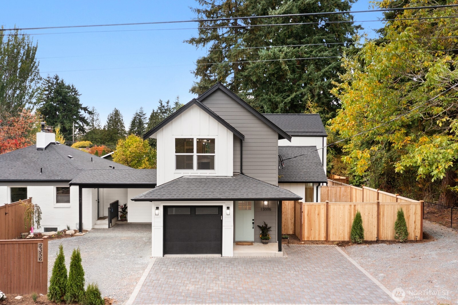 Welcome to M2 at Haller Lake, where modern design meets Northwest charm in this beautifully crafted new construction home. $5k lender credit available through a Community Reinvestment Act program. Perfectly positioned on a bright corner lot, this residence offers privacy, natural light and convenient North Seattle living. Step inside to discover a thoughtfully designed open floor plan boasting soaring 8+ ft ceilings, expansive windows & modern finishes. The chef-inspired kitchen anchors the main living space with custom cabinetry, Quartz counters, luxury SS appliances & a rare oversized walk-in pantry.    The inviting living area features a modern fireplace & seamless flow for gatherings, while large windows bring in abundant natural light year-round. Upstairs, the private primary suite offers a peaceful retreat with a spa-inspired bath featuring custom Italian tile & refined finishes. A spacious second ensuite bedroom provides excellent flexibility for guests, a home office or additional living space.    Outdoor living is effortless with your private fenced yard and patio, perfect for summer BBQs or morning coffee. The home offers both comfort & connectivity while including a dedicated off-street parking space and an attached single-car garage. Located just moments from Haller Lake, Northacres Park trails, shopping, dining & the Light Rail Station. Don't wait, you have found your new home!