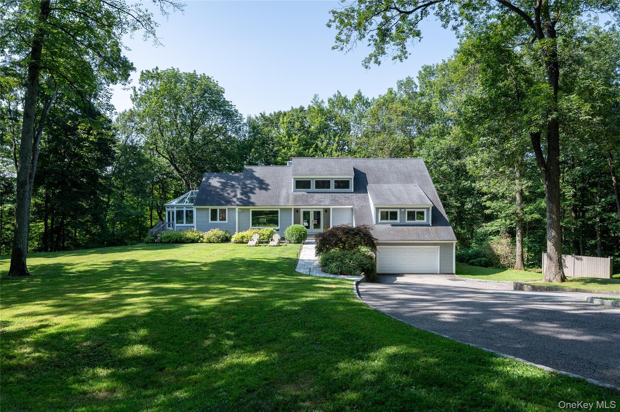 Welcome to this stunning 4-bedroom modern home, perfectly nestled on a quiet no-through street in the sought-after Whippoorwill neighborhood of Armonk. Surrounded by nature and flooded with natural light, this home offers a seamless blend of style, comfort, and convenience. Step inside to discover an open, sun-filled layout with newly renovated kitchen and bathrooms, designed with today’s lifestyle in mind. The first-floor primary suite offers ease and privacy, while a flexible home office space and a dramatic solarium room provide ideal settings for work, relaxation, or entertaining. Enjoy the expansive deck overlooking lush greenery—your own private retreat just minutes from the heart of Armonk, 10 minutes to the North White Plains train, and 13 minutes to downtown White Plains. Located in the award-winning Byram Hills School District, this home truly has it all. Don’t miss this rare opportunity.