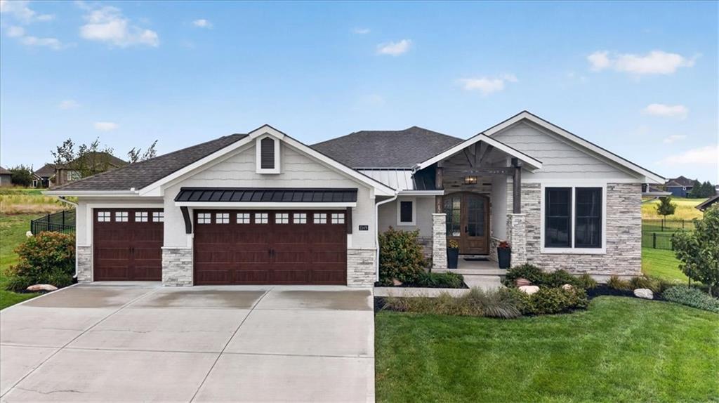 Welcome to Signature Builders’ “The Brookside,” where thoughtful design, luxury finishes, & an exceptional golf course setting come together in one unforgettable home. Positioned along Fairway 9 of Creekmoor’s award-winning 18-hole golf course, this home offers beautiful views & a lifestyle that would be nearly impossible to rebuild at this price. The open-concept main level immediately impresses W/soaring 12-foot ceilings, wood beams, extensive custom trim, & designer finishes throughout. At the center of the home is an expansive kitchen w/a large granite island, illuminated cabinetry, & a spacious walk-in pantry. The adjoining dining & living areas create an inviting space for everyday living & effortless entertaining. The generous primary suite on the main level offers a peaceful retreat w/a spacious walk-in closet and dedicated shoe storage. The conveniently connected laundry room includes a utility sink. An oversized second bedroom on the main level provides wonderful flexibility as a guest suite or private home office. The finished lower level was designed for gathering, complete w/an impressive recreation room, wet bar, full-size refrigerator, separate office, two additional bedrooms, & a shared Jack & Jill bathroom. Outdoor living is equally inviting with an expanded patio, fenced backyard, and picturesque views across the course. The east-facing setting welcomes the morning sun while providing comfortable afternoon shade, making it an ideal spot for sunrise coffee, weekend barbecues, or end-of-day cocktails. Creekmoor residents enjoy an unmatched community lifestyle centered around its award-winning 18-hole golf course, clubhouse with approximately 6,000 sq. ft., Tavern on the Moor, pro shop, fitness facility, community pools, sports courts, walking trails, & 108-acre lake. This is more than a beautiful home. It is an opportunity to experience one of the Greater Kansas City area’s most desirable communities at a value you simply could not recreate today.