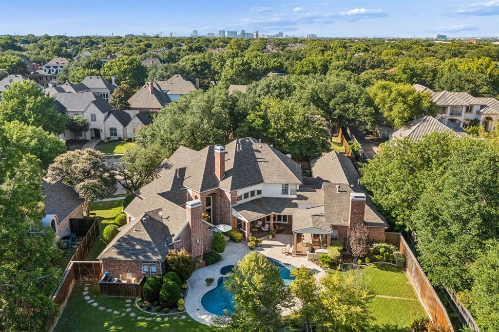 OPEN HOUSE THURSDAY, SEPT. 17  5–7 PM! Come experience Willow Bend luxury where nearly half an acre, a private pool and spa, gated driveway, and 4-car garage create a rare combination of space, privacy and lifestyle in Plano West.Tucked away on a quiet cul-de-sac, this beautifully updated home delivers the kind of indoor-outdoor living buyers are looking for today. The remodeled chef’s kitchen is designed to impress with a commercial-grade gas range, Vent-A-Hood, double ovens, built-in refrigerator, wine refrigerator, abundant cabinetry and generous prep space. Expansive sliding doors open the main living areas to the backyard, making entertaining effortless.Step outside and discover your own private retreat. The redesigned backyard features a sparkling pool and spa, outdoor kitchen, expansive covered patio and multiple entertaining areas, plus plenty of grassy space for pets, play and gatherings. It’s equally suited for a summer pool day, weekend barbecue or quiet evening at home. The spacious primary suite offers a sitting area and fireplace, while the remodeled 2021 primary bath creates a true retreat with dual vanities, custom tile, freestanding soaking tub, oversized walk-in shower, separate dressing area and two custom walk-in closets.With multiple living and flex spaces, the home easily adapts to the way you live. A downstairs game room or media room, bonus space and versatile areas for a home office or multi-generational needs provide exceptional flexibility. Upstairs are four generous bedrooms, three updated full baths and another bonus room.Located in sought-after Plano West near the Dallas North Tollway, Legacy West, The Shops at Legacy, shopping, dining & entertainment, with a neighborhood park just a short stroll away.Nearly half an acre + pool + spa + outdoor kitchen + 4-car garage + gated drive + flexible living spaces = a Willow Bend opportunity worth seeing in person. Join us Thursday from 5–7 PM or schedule your private showing today!
