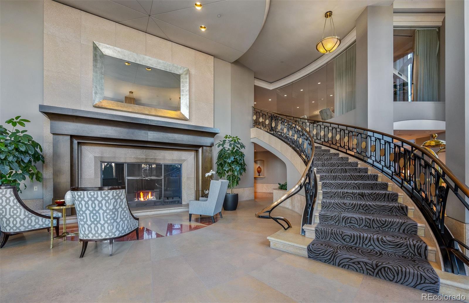 High style in Denver's premier luxury condominium building situated in sought after Cherry Creek! This stunning residence with a designer's flair will wow you with its desirable open floorplan and custom features throughout. Enjoy fabulous mountain, city, and golf course views from expansive and gracious rooms.  Entertain with aplomb in the lovely Living Room with chic custom fireplace, and elegant adjoining formal Dining Room. Of special note, a spectacular custom Kitchen with quartz and granite countertops, stone backsplash, high end stainless appliances and counter seating. The Primary Suite includes a recently fully renovated five piece bathroom, while an additional Bedroom Suite completes the picture, perfect space for guests or office. Lovely hardwood floors and new high end carpeting throughout.In warm weather, you’ll love dining on the large private patio and grilling outside while watching the sun set over the Denver Country Club golf course with the Rocky Mountains in the background.One Polo Creek is among Denver’s most preeminent addresses, noted for its exceptional 24 hour concierge, meticulous upkeep, and superior amenities, including a fitness center, guest suites, conference/game rooms, and delightful outdoor recreation area. One Polo Creek is ideally located within a stone’s throw of Cherry Creek’s renowned shopping and dining!