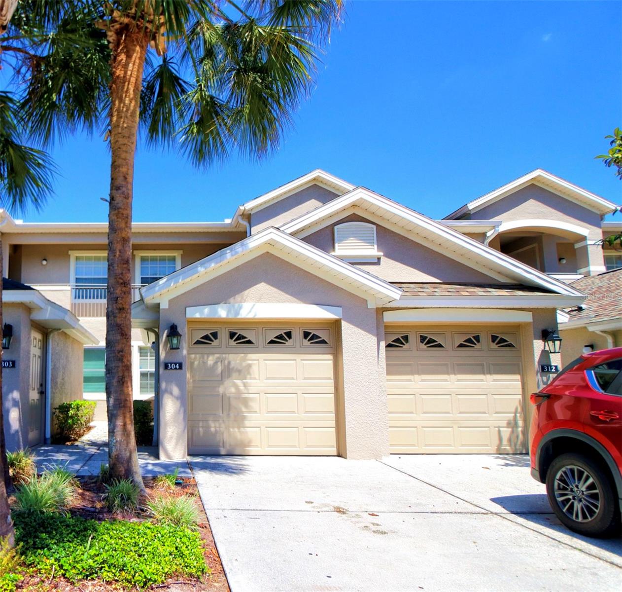 LOVELY, Well maintained, bright and airy! Make this home your own and enjoy the Florida golf community lifestyle or use it as an investment property! Convenient first-floor condo with a prime location in Lake Nona, on the 8th green of the world-class North Shore Golf course. This home provides spectacular views to enjoy your morning coffee or evening beverage from your covered, screened in backyard patio. Plenty of kitchen cabinetry with easy clean ceramic tile flooring and breakfast bar. Open floor plan with dining and living room looking out onto the gorgeous views. The spacious primary suite has two walk in closets with custom shelving, a bathroom with dual sinks and large walk in shower.