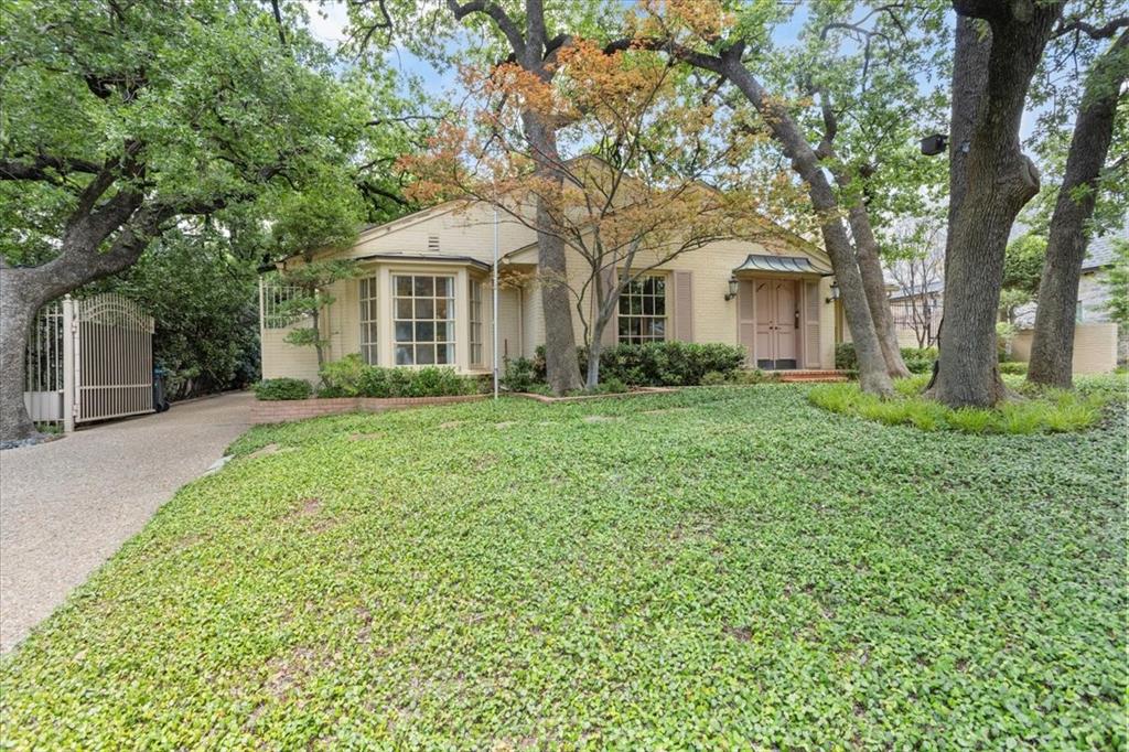 Situated on a generous lot in the heart of Crestwood, 404 Eastwood offers a rare opportunity to renovate or rebuild in one of Fort Worth’s most sought-after neighborhoods. This 3-bedroom, 4.1-bath home features spacious rooms, multiple living areas, and distinctive architectural touches, including a charming garden room and a French-style brick privacy wall that frames the backyard. An electric gated driveway adds privacy and convenience, and a storage room off the carport with a half bath provides a bit of extra storage space. Just steps from the Trinity Trails and minutes to River Crest Country Club, this property blends a premier location with endless potential. Whether you choose to restore the existing home or build new, the setting and scale of this lot present a truly exciting opportunity.