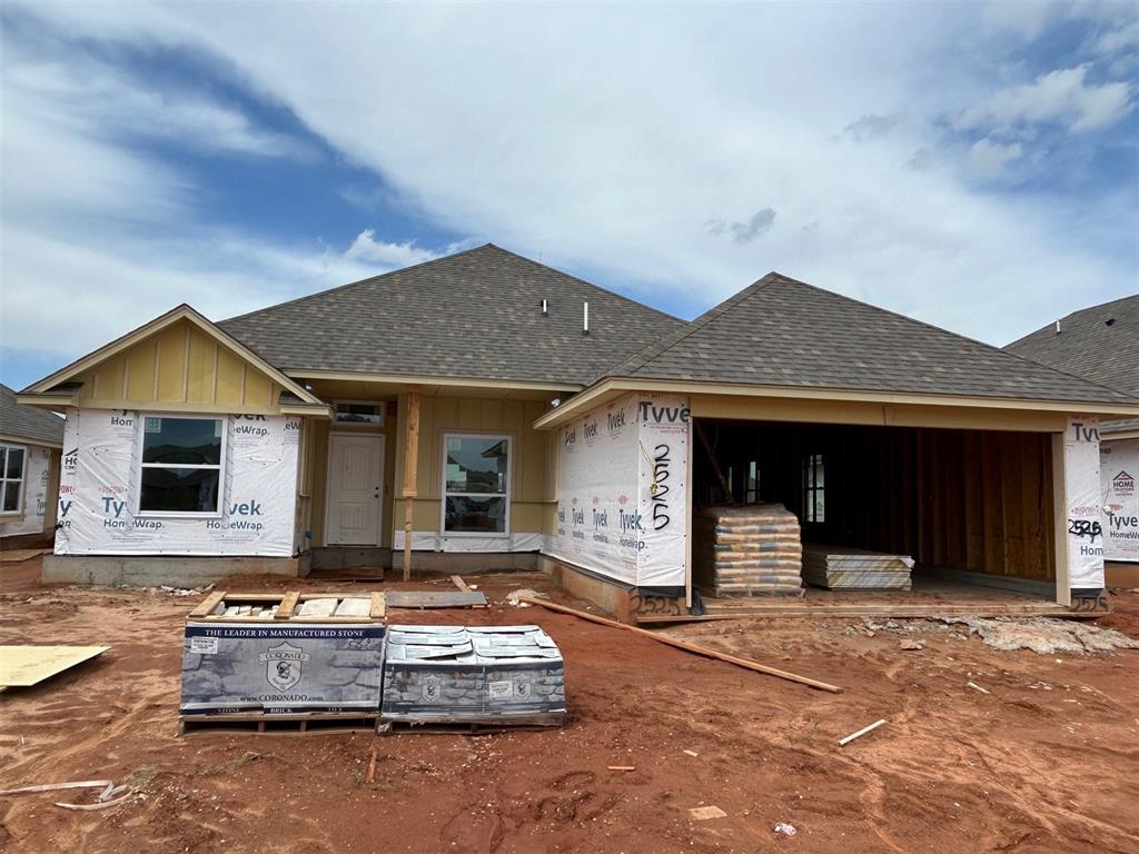You will love the layout and finishes in this home! Wide and welcoming living room features a beautiful wood and stone fireplace. Attractive wood tile is in all the main areas of the home. The kitchen is loaded with a large island, farm sink, thick quartz tops, stainless steel Samsung built-in appliances, custom cabinets, under cabinet lighting, decorative wood vent hood, led lighting, pendants and more! The primary bedroom is roomy and the primary en suite comes with a large tiled shower, garden tub, raised two sink vanity and huge closet. Both spare bedrooms are large with spacious closets. Covered back patio. Charming study with sliding barn door. This home backs up to an HOA maintained common area, providing extra space and privacy. Neighborhood amenities include a large playground, pool and clubhouse with fitness center and gathering hall!