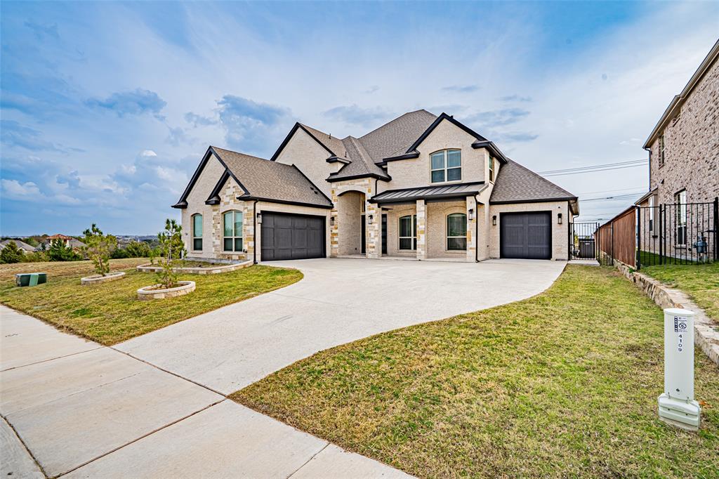 Welcome to this stunning practically new home in the highly sought-after La Frontera community. With over 4,000 square feet of thoughtfully designed living space this residence perfectly balances elegance, comfort, and functionality ideal for everyday living and effortless entertaining.The kitchen serves as the heart of the home showcasing modern design, an open layout, and seamless flow to the breakfast nook and spacious living room with a cozy fireplace. Host memorable gatherings in the formal dining room or stay productive in the private office. The main-floor primary suite offers a tranquil retreat complete with an en-suite bathroom featuring dual sinks, a jacuzzi tub, a separate shower, and a generous walk-in closet. Upstairs the possibilities are endless with an expansive game room along with a dedicated media room featuring a built-in wet bar. The Texas-sized bedrooms upstairs all include walk-in closets and two of them share a convenient Jack-and-Jill bathroom with separate dual sink areas. Step outside to the covered patio and fully fenced backyard an ideal setting for relaxing summer evenings. Located just moments from Eagle Mountain Lake you’ll enjoy convenient access to boating, fishing, swimming and countless outdoor adventures. La Frontera offers exceptional amenities including walking trails, picnic areas, parks, and a splash pad. Plus, the home’s prime location provides easy access to major highways, shopping, dining, and top-rated schools. This home offers the perfect blend of luxury and practicality and includes numerous upgrades such as stainless steel appliances, luxury tile and carpet, upgraded kitchen cabinetry and countertops, a jacuzzi tub in the primary bath, built-in surround sound, 2-inch faux blinds throughout, a grand two-story entry with iron stair railing, double front doors, a partial circular driveway, a fully built-out media room, and so much more. Hardly lived in and meticulously maintained this exceptional home is move in ready!