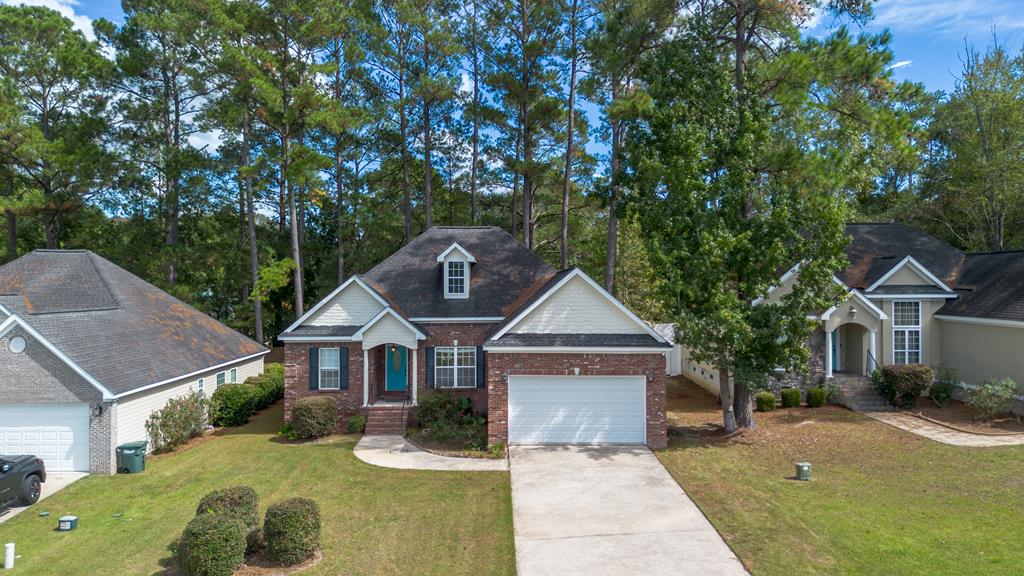 Welcome to Jordan Oaks — this beautifully maintained home is move-in ready! Featuring 3 spacious bedrooms, 2 bathrooms, and approximately 1,606 square feet of living space, this light and airy home offers laminate wood flooring, dramatic 10-foot ceilings, and elegant crown molding. Enjoy a cozy fireplace, a modern kitchen with granite countertops, an eat-in breakfast nook, and a separate formal dining room. The primary suite and secondary bedrooms are generously sized, providing comfort and versatility. Outdoor highlights include a private deck area and dedicated parking. This home combines style, functionality, and warmth — ready for its next owner to move right in!