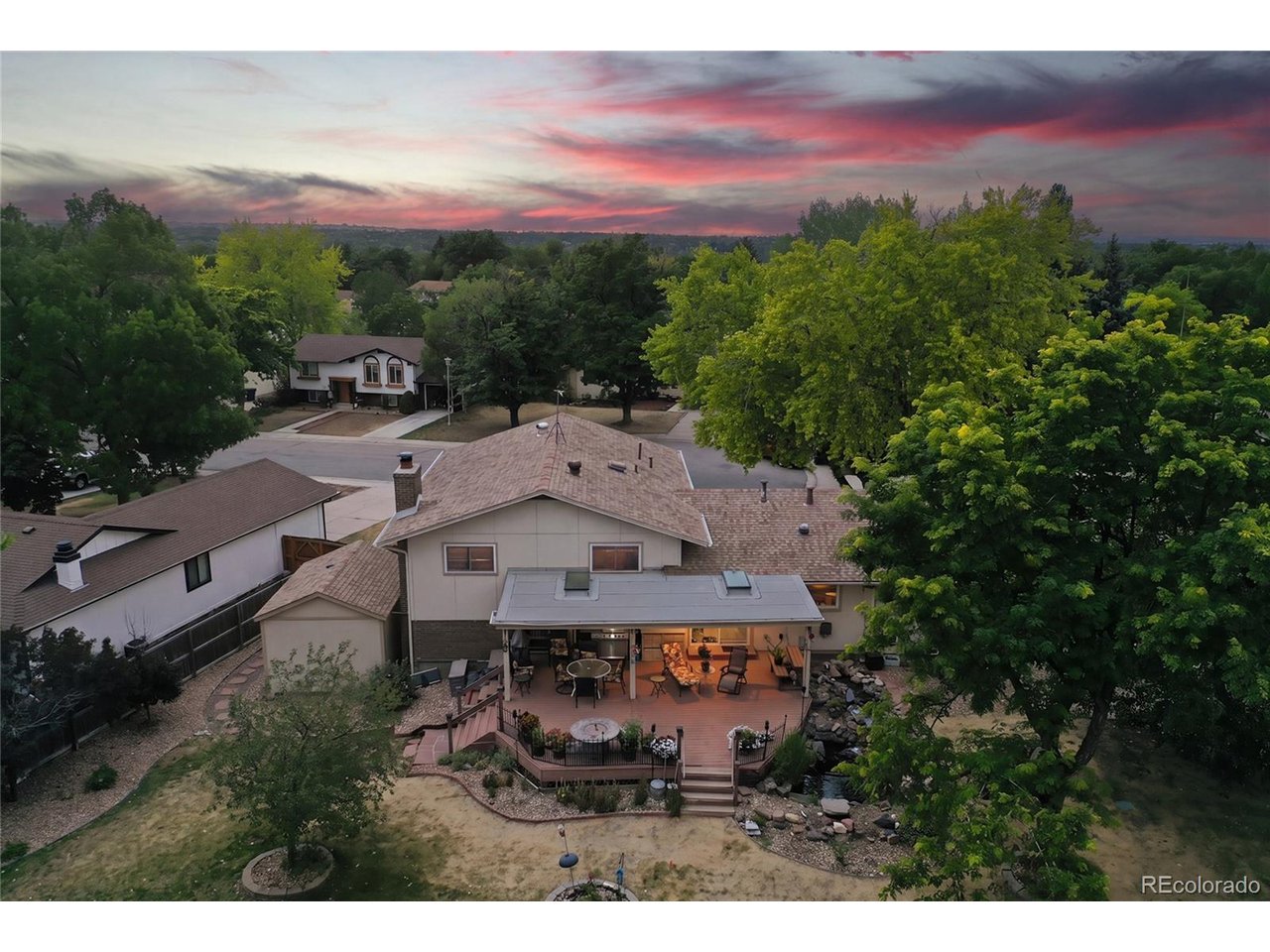 Set on a generous lot in Walnut Hills, this home offers a rare combination of space, flexibility and location, with no HOA! Mature trees and landscaping frame a large backyard with a fish-filled pond, garden area and room to enjoy the outdoors. The main level features an inviting living room with abundant natural light, a well-appointed kitchen with ample cabinetry and workspace, and a dining area that opens to the backyard. Upstairs, the spacious primary suite offers a comfortable retreat with 5-piece bath and walk-in closet, while additional bedrooms provide flexibility for guests, work or hobbies. The lower level adds even more living space for a family room, office, gym or media area! The backyard is where this property really stands out, offering a peaceful setting with mature landscaping, a fish-filled pond and a dedicated garden area with space to grow, entertain or simply enjoy the outdoors. Two storage sheds add practical storage, while the detached workshop with electricity provides a separate space for woodworking, crafts, gardening, fitness or whatever project you have in mind. There's room here for both the things you want to do and the things you need to store. The location is hard to beat, with easy access to I-25, C-470, the Denver Tech Center, Lone Tree and Greenwood Village. The Streets at SouthGlenn, Park Meadows, restaurants and everyday conveniences are all nearby. Walk or bike to the High Line Canal, Big Dry Creek, Centennial Link, Little Dry Creek and Willow Creek trail systems, with the Cherry Creek Greenway also close by. Dry Creek Light Rail Station is nearby, and Dry Creek Elementary is within walking distance. Located in the Cherry Creek School District, this home combines a versatile floor plan, exceptional outdoor space and convenient access to the best of the south metro area.