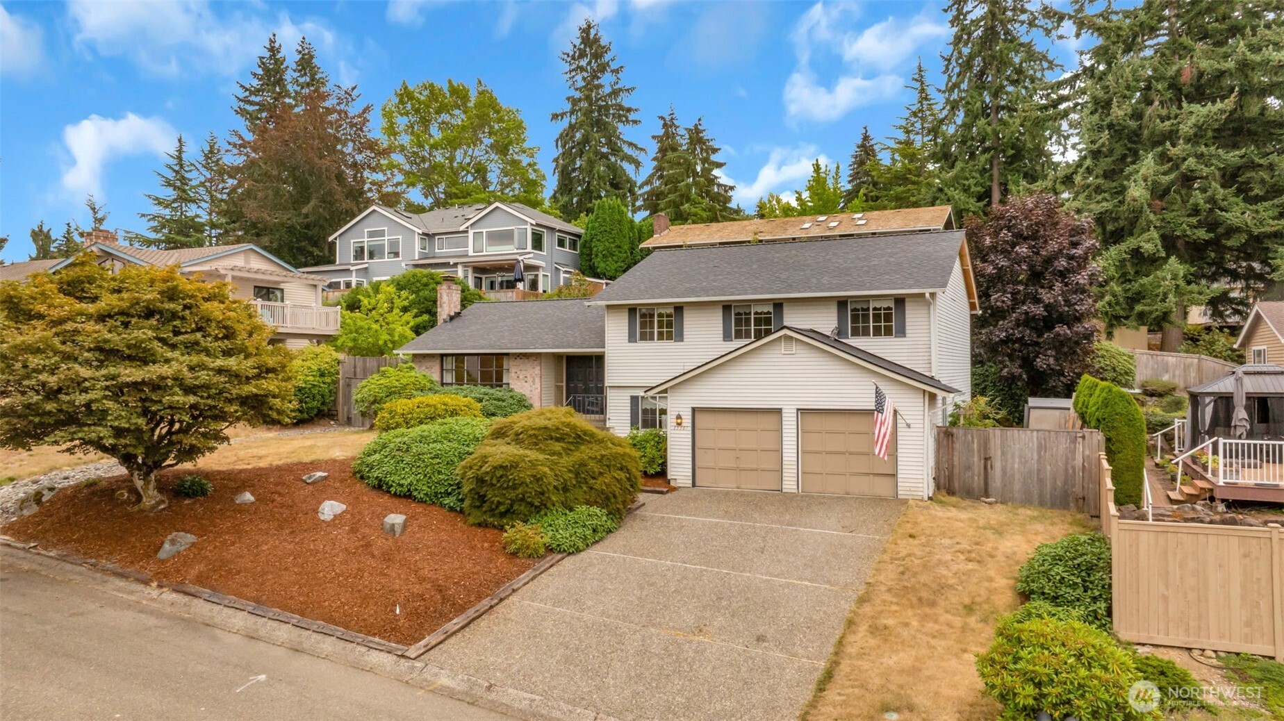 Unique opportunity with upside potential on a quiet dead end street. Located in the Award-Winning Newport High School district. Tremendously large entertainment deck with a peacefully private backyard setting. Mature landscaping for easy maintenance. Comfortably large primary suite with a private bath and walk-in closet. Separate living and dining room for holiday entertainment. Open kitchen with eating area. Three other adequately sized bedrooms. Downstairs has room for a media room or a game room hangout. New roof & furnace.  Located in the I-90 corridor, close to Bellevue College, shopping, transit, downtown & games. Well maintained home. Roof is 1 year old, with 30 year Warranty. Furnace is 2 years old.