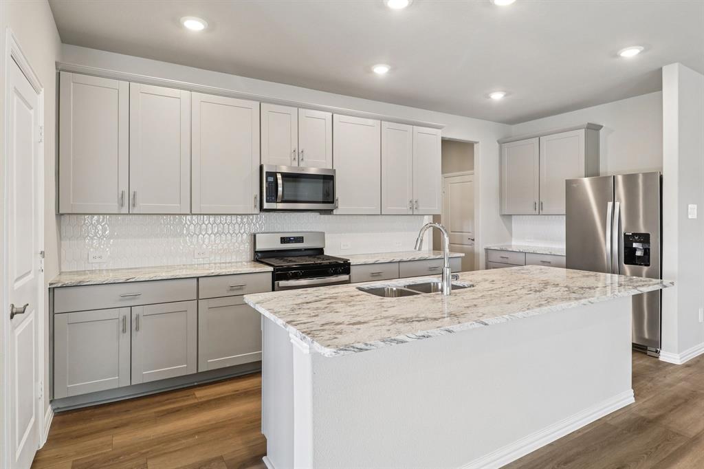 Brand new, energy-efficient home! Try a new recipe in the Woodside’s impressive kitchen, complete with a useful island and large pantry. White cabinets with veined white quartz countertops, beige tone EVP flooring with beige tweed carpet. Ditch your long commute with quick access to McKinney, Frisco, and Richardson on US 380 and spend more time doing what you love. Play fetch at the nearby dog park or bike the miles of Simpson Crossing’s trails and greenspace. Kids will love the community playground and resort-style pool. We also build each home with innovative, energy-efficient features that cut down on utility bills so you can afford to do more living.* Each of our homes is built with innovative, energy-efficient features designed to help you enjoy more savings, better health, real comfort and peace of mind.