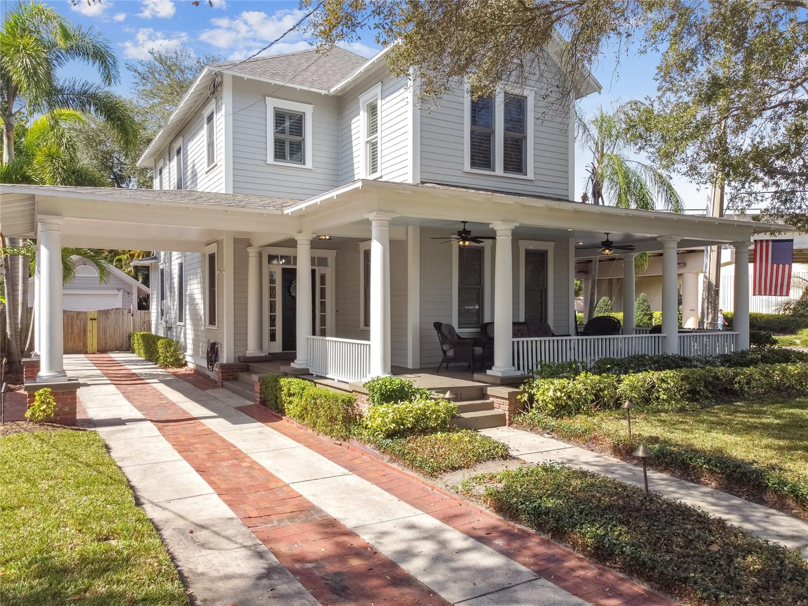 Under contract-accepting backup offers. Nestled in the heart of one of Tampa’s most prestigious historic neighborhoods, this classic custom bungalow offers unbeatable walkability to the best of Hyde Park and South Tampa. Blending timeless charm with the expectations of modern design and construction (built in 2000), the home is perfectly suited for both everyday living and entertaining—especially during Gasparilla season! Expansive enclosed porches seamlessly connect to a spacious open floor plan, featuring a solid foundation, 10-foot ceilings, and custom windows adorned with plantation shutters throughout. The chef’s kitchen showcases 42-inch cabinetry and a custom statement island, anchoring the vibrant main living space. Upstairs, two separate primary suites provide exceptional privacy, each with spa-inspired en-suite baths, oversized showers, generous walk-in closets, and designer finishes. A conveniently located laundry area and an enclosed office nook complete the second level. Downstairs, a well-appointed private guest suite offers a large closet and an adjacent full bathroom. The rear porch opens to a fully paved patio surrounded by lush tropical landscaping. Adding exceptional versatility, the property also includes a 240 interior heated/air conditioned separate casita featuring a studio layout with a full bathroom—ideal for guests, a private home office, gym, or additional flex space. Relax on the wide, wraparound porches and enjoy views of the Swann Pond fountains while soaking in the vibrant energy of this sought-after neighborhood. Just two blocks from Hyde Park Village, residents enjoy access to dozens of upscale shops and restaurants, and within eight blocks lies Bayshore Boulevard, multiple parks, two major grocery stores, and over 30 popular dining and entertainment destinations along South Howard Avenue. Recently named the best place to live in Florida, Hyde Park offers an unparalleled lifestyle—one this exceptional home delivers and more.