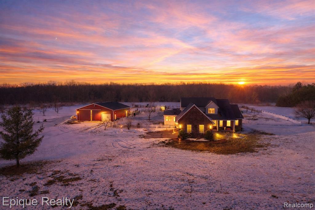 Discover the perfect blend of modern luxury and homesteading heritage in this meticulously maintained 3,050 sq ft split-level home, cherished by only two owners since 2001. Situated on 10 sprawling acres, the interior shines with a fully updated kitchen, fresh paint, new fixtures, and stylish LVP flooring throughout the lower level. The functional layout features a coveted first-floor primary suite and a cozy sunroom anchored by a gas fireplace, while a dedicated mudroom addition leads to the oversized 2-car garage. Peace of mind comes standard with a new furnace (2024). Outside, the property is a true producer's paradise, featuring a mature orchard of peach, cherry, apricot, apple, and pear trees, alongside two full-sized chicken coops, a pig pen, and a horse stall. The massive barn with a heated shop offers the ultimate workspace for any hobbyist or professional. This rare estate seamlessly combines move-in-ready comfort with the infrastructure to live your farmhouse dreams.