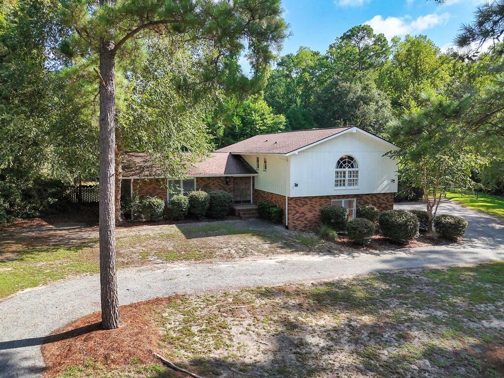 Beautifully remodeled and ready to enjoy! This spacious split-level 3-bedroom, 2.5-bath home offers 2,489 square feet of living space on 1.44 acres. The home features a newly remodeled kitchen, updated bathrooms, and two living areas that provide plenty of space for relaxing, entertaining, and everyday living. Step outside to enjoy the large pool, perfect for relaxing, entertaining, and making memories while taking advantage of the privacy and space this property has to offer. Conveniently located near a walking trail and just minutes from downtown Moultrie, you'll have easy access to shopping, dining, and local amenities. With plenty of room both inside and out, a spacious floor plan, extensive updates, and two living areas, this is a great opportunity to own a move-in-ready home with room to spread out in Moultrie.