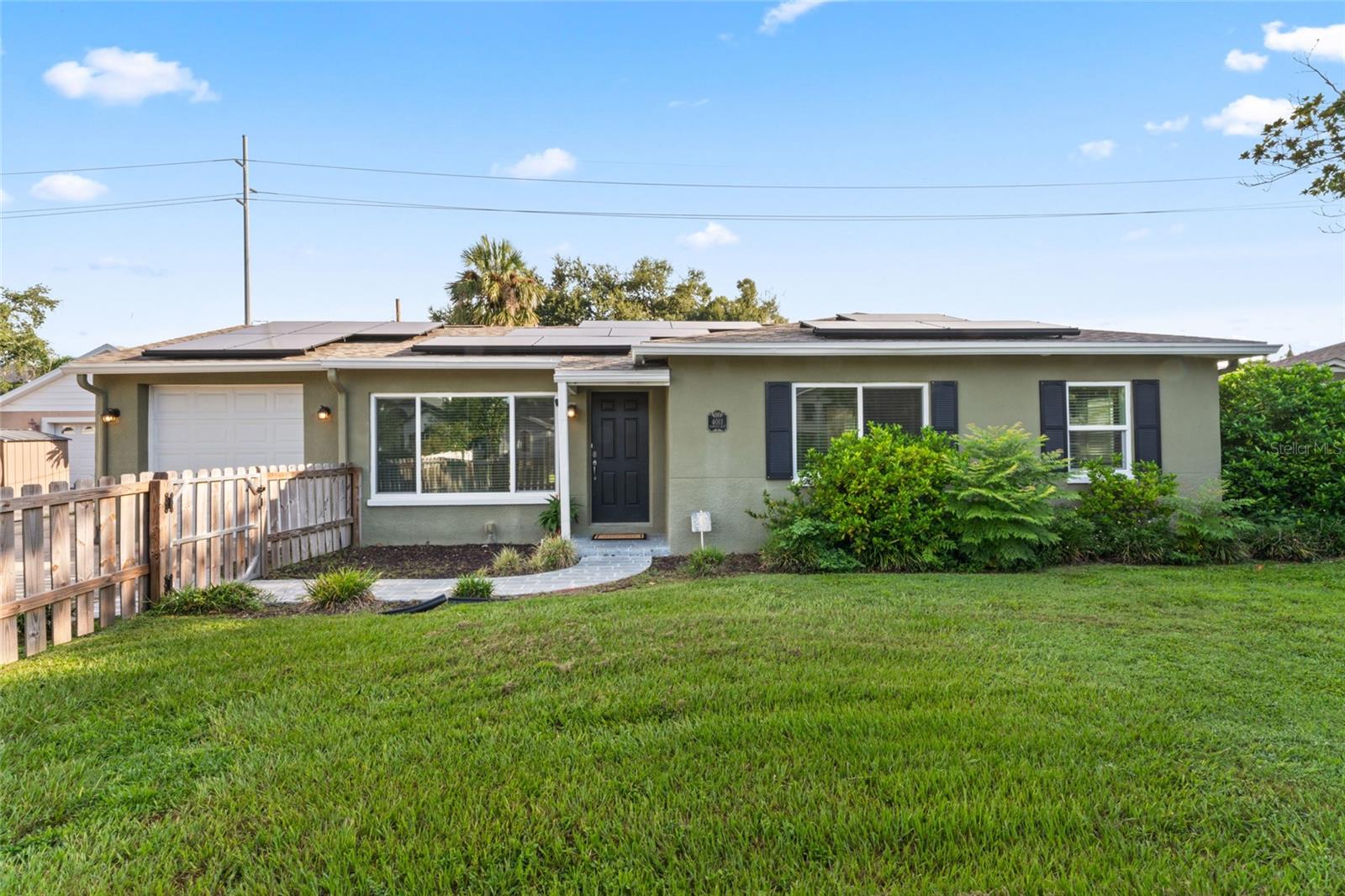 Welcome to your dream home in the heart of South Tampa! Situated within the highly desirable Roosevelt, Coleman, and Plant school districts, this residence perfectly balances comfort, style, and convenience for both families and professionals. Located in Flood Zone X, flood insurance is not currently required.

The main home features three spacious bedrooms and two bathrooms, including a primary suite with a walk-in closet and private ensuite bathroom. Multiple living and dining areas provide the ideal layout for everyday living and entertaining. A one-car garage and extended driveway ensure plenty of parking for family and guests.

Step outside to enjoy an expansive, fully fenced backyard that doubles as your private retreat. Perfect for gatherings, the backyard also leads to a newly constructed 425-square-foot guest house complete with its own kitchen, living room, bedroom, and full bathroom. Whether for guests, extended family, or a private office, this space offers exceptional flexibility. Additional highlights include a large temperature-controlled storage shed for all your storage needs.

This energy-efficient home is equipped with solar panels for minimal electric costs and features numerous updates, including a newer roof (2019), newer AC (2020), hurricane-impact windows, and a fully insulated attic for year-round comfort.

Located minutes from Tampa’s best shopping, dining, entertainment, and the scenic Bayshore Boulevard, this home offers the best of South Tampa living.

Don’t miss the chance to make 4011 W El Prado Blvd. yours. Schedule your private showing today!