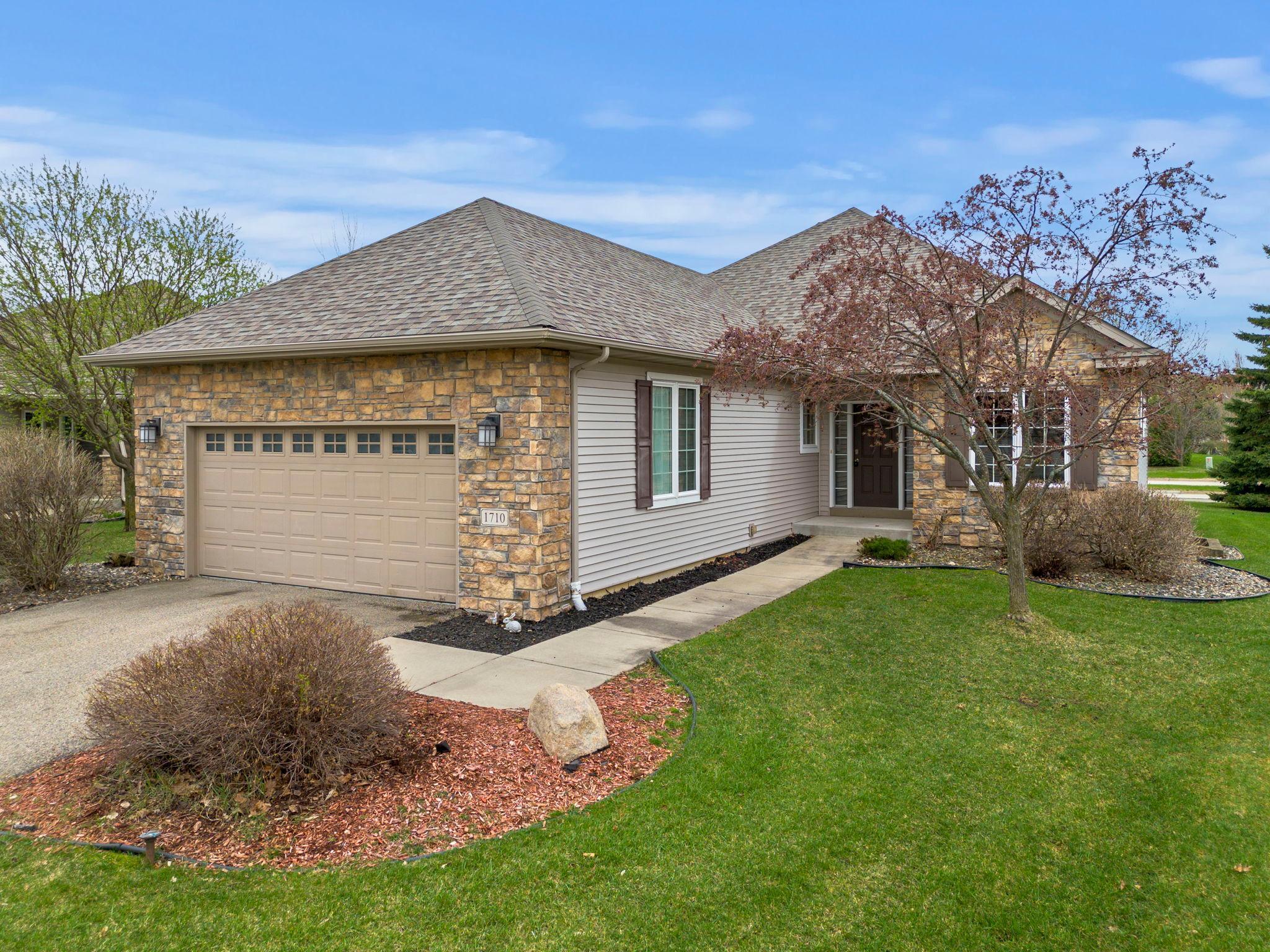 Welcome to this beautifully maintained and extensively updated 4-bedroom, 3-bathroom home nestled in a quiet Northfield neighborhood. Designed for convenient main-level living, this home offers all essential living spaces on one level, along with the ease of maintenance-free living—thanks to an HOA that covers snow removal and lawn care. Recent updates include fresh paint and new carpeting throughout, a new garbage disposal, reverse osmosis system, stove, refrigerator bins, laundry tub and faucet, updated bathroom showers, Hunter Douglas window shades, a new water heater, two Vitasalus water filtration systems in the basement, duct cleaning and freshly painted garage walls.Spacious and well-appointed home featuring a tiled foyer with coat closet. The kitchen offers abundant cabinetry, expansive counter space, stainless steel appliances, a walk-in pantry, and an informal dining area. A formal dining room with large window and chandelier flows into a bright living room with surrounding windows and a cozy gas fireplace. The main level includes two bedrooms, highlighted by a primary suite with walk-in closet and private ensuite featuring a soaking tub, walk-in shower, and dual vanities. A second bedroom offers flexibility as an office or den with built-ins and ample storage. A convenient main-level laundry room provides garage access. The lower level is ideal for entertaining with a spacious family room, new carpeting, wet bar, and abundant natural light. Two additional generously sized bedrooms with egress windows and a nearby ¾ bath complete the space. Additional highlights include ample storage, under-stair storage, and a large unfinished utility room. A perfect blend of comfort, functionality, and move-in-ready appeal.