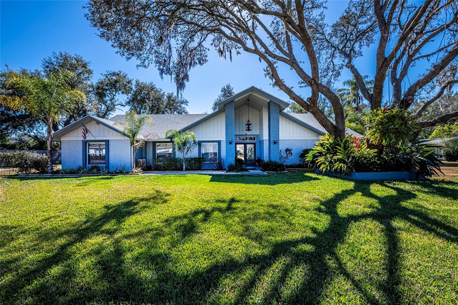 Priced to Sell!Tucked away on a quiet half-acre homesite in Hammock Woods, this property offers a rare sense of peace, privacy, and tranquility. Surrounded by mature trees and open space, the setting delivers a calm, retreat-like lifestyle where you can truly unwind, enjoy nature, and experience the privacy so many buyers are searching for—yet still remain within convenient reach of everyday amenities.The main home features 3 bedrooms and 2 full bathrooms and has been completely remodeled, making it truly turn-key. Renovations completed in 2018, 2022, and 2025 include a stunning new kitchen with custom cabinetry, diamond-cut quartz countertops, tile flooring, and all-new Samsung stainless steel appliances. Additional upgrades include fully remodeled bathrooms, re-stained hardwood floors, fresh interior and exterior paint, new doors, updated lighting and fixtures, a new roof, new 5-ton AC system, and three mini-split systems. A cozy wood-burning fireplace adds warmth and character to the main living area.Outdoor living and functionality are exceptional, with a 10’ x 32’ aluminum-covered rear patio featuring two new sliding glass doors, an 11’ x 14’ covered BBQ area, an 11’ x 18’ wood deck with fire pit, and multiple storage options including a 10’ x 16’ full-size workshop and an additional metal shed. A large 18’ x 36’ galvanized covered structure provides ideal space for an RV, boat, or multiple vehicles, along with ample parking throughout the property.Completing the property is a separate 1-bedroom, 1-bath guest apartment with a full kitchenette, offering excellent flexibility for extended family, visitors, or private accommodations. The suite includes new cabinetry, wood laminate flooring, a walk-in closet, a full-size tile shower, generous storage, and a private entrance located on the far side of the home near the driveway.If you’re seeking quiet, private living with modern upgrades and versatile space, this is a must-see property. Schedule your private showing today and experience the peaceful lifestyle Hammock Woods.