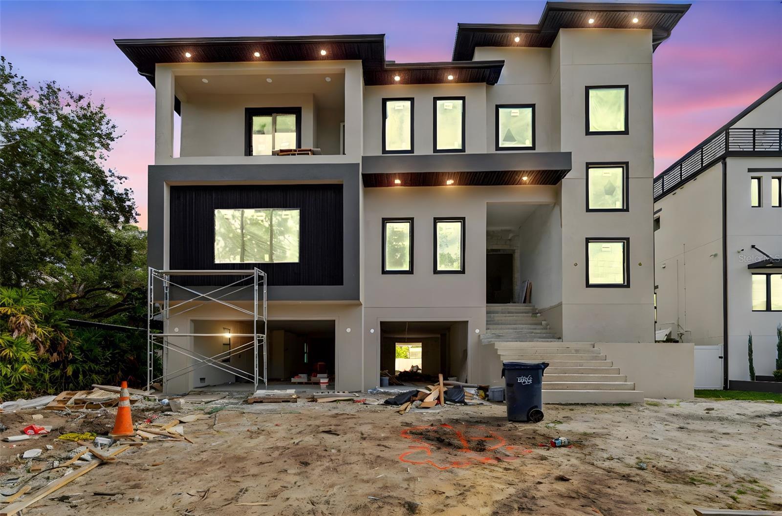 Under Construction. Built for You. Built to Last.Two exceptional new construction homes are being offered for sale on the same street in South Tampa’s Beach Park neighborhood. The price reflects each individual residence.204 S Occident Street delivers in March 2026; 211 S Occident Street delivers in June 2026. Both feature similar floor plans with 6 bedrooms and 7 bathrooms.Luxury, elevation, and scale define this extraordinary multi-level new construction residence, thoughtfully designed for long-term livability and grand-scale entertaining.The entire first level is dedicated to garage and entertainment, offering over 3,000 square feet of open, flexible space designed for hosting large gatherings, private events, or showcasing an exceptional vehicle collection. An 11-car garage anchors this level, creating a truly rare lifestyle offering in South Tampa.A large private elevator seamlessly connects the garage level to the two upper living floors, delivering effortless access and flow throughout the home.The main living level is designed to impress, anchored by a massive living room with tray ceilings approaching 13 feet, creating dramatic volume and light. Luxury engineered hardwood flooring runs throughout, elevating the home’s modern architectural lines. The kitchen is a true showpiece, featuring an extremely oversized island with waterfall luxury quartz and high-end cabinetry extending to the ceiling, delivering both visual impact and exceptional functionality.Three oversized balconies extend the living space outdoors, creating multiple environments for entertaining and relaxation. A spacious loft adds flexibility for media, lounge, or additional entertaining space.The owner’s suite is a private retreat, highlighted by a spa-style bath with a freestanding tub, offering a serene, resort-like experience.Walk to a brand-new Publix—located under 100 meters from the home—an exceptionally rare convenience in South Tampa.A rare opportunity to own a substantially scaled, elevated, and entertainment-driven luxury residence in one of South Tampa’s most desirable neighborhoods.