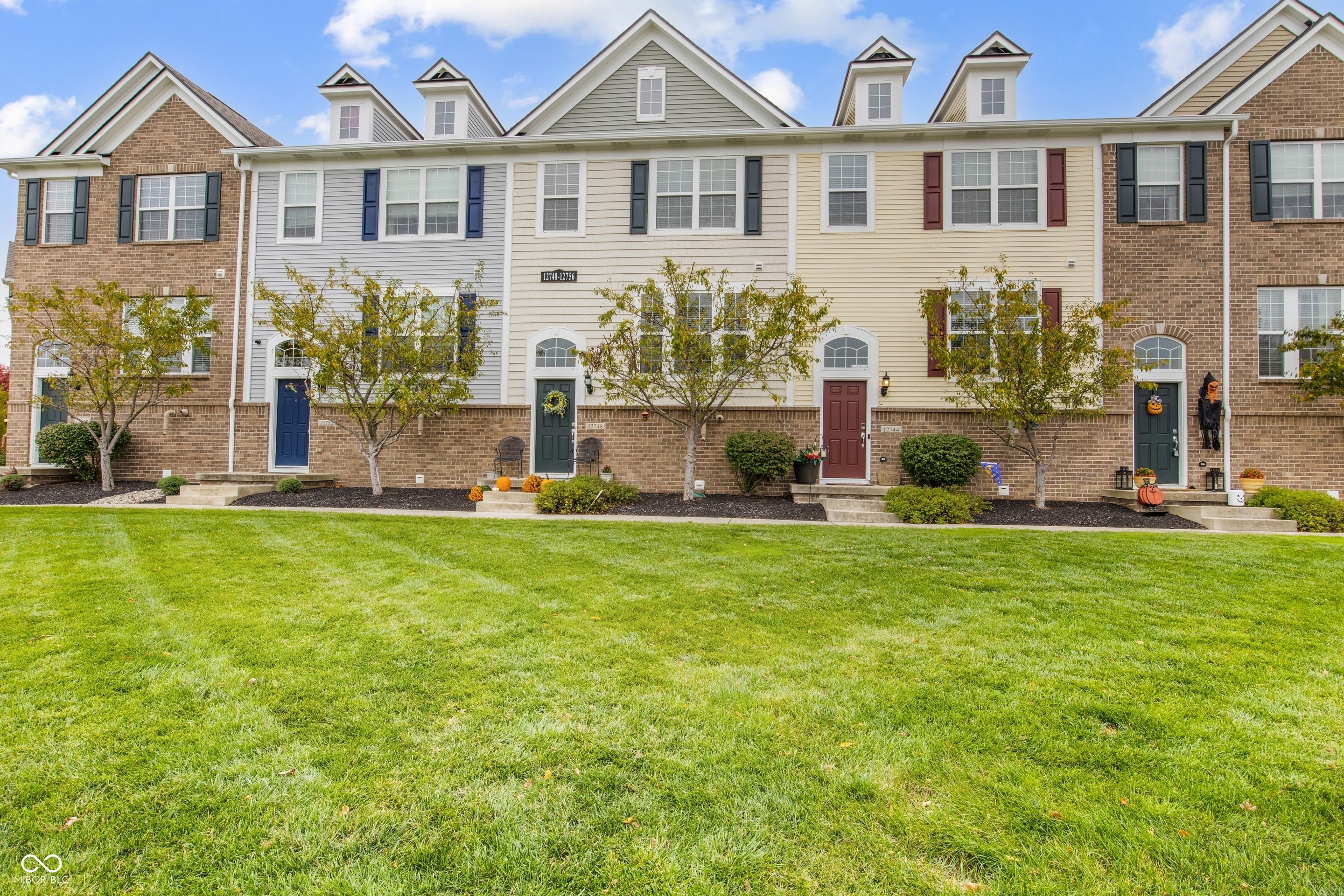 Incredible opportunity awaits in this beautifully maintained 3-bedroom, 2.5-bath  townhome, perfectly situated in the highly sought-after Avalon of Fishers community! Offering 1,540 sq. ft. of thoughtfully designed living space, this home blends comfort, style, and low-maintenance living in one perfect package. The open-concept main floor is bathed in natural light, enhanced by rich hardwood flooring and large windows that fill the space with sunshine.  The gourmet kitchen impresses with 42" staggered cabinets, solid surface countertops, and stainless steel appliances - ideal for both everyday living and entertaining. The Avalon community is second to none, featuring resort-style amenities such as a pool, tennis courts, walking trails, and open green spaces. Ideally located near award-winning HSE schools, Hamilton Town Center, and major thoroughfares like 126th Street, this home offers unmatched convenience and community living.    Don't miss your chance to own in one of Fishers' most desirable neighborhoods - schedule your showing today!