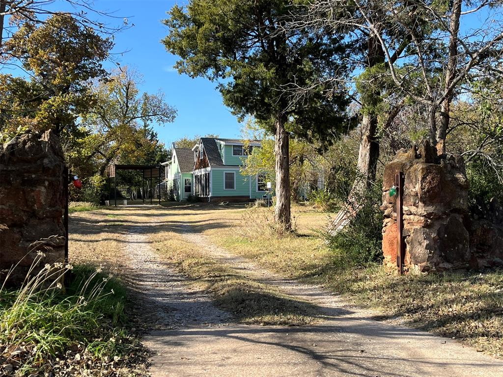 Fantastic fixer upper opportunity on 1 acre MOL in a desirable neighborhood. Live in the front area 1,385 sq. ft, while you "fix up" the 2,372 sq. ft. Perfect for large families; teenagers, grandma and grandpa to come live with you. There's room for Aunt Betty, too. Details of roof, plumbing, HVAC, etc. provided on disclosures. Beautiful lot with trees, bulbs, wild flowers, gated area for Scooby, etc. Easily accessible to everything!
