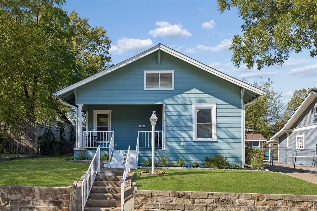 This charming, move-in-ready 3-bedroom, 2-bath Craftsman with a spacious 1-car garage enjoys a stellar North Oak Cliff location! Just half a mile from Bishop Arts, one block from acclaimed neighborhood restaurants, and minutes from Lake Cliff Park, the Dallas Streetcar, and Downtown Dallas. Perched on an elevated interior lot, this inviting home features a welcoming front porch, spacious living and dining areas, abundant natural light, and rich hardwood floors throughout. The updated kitchen offers granite countertops, stainless steel appliances, a gas range, and breakfast bar seating. Two generous bedrooms share a beautifully updated hall bath. The third bedroom offers exceptional flexibility with its own ensuite bath and private backyard entrance—ideal for a guest suite, home office, expanded primary suite, or potential ADU-style use (subject to city approval). Enjoy a spacious fenced backyard, covered patio, detached garage, and additional covered parking. Improvements include double-pane windows, updated siding, AC ductwork, 2018 roof, EV Charger! A wonderful blend of historic charm, modern updates, and urban convenience in one of Dallas' most vibrant neighborhoods!