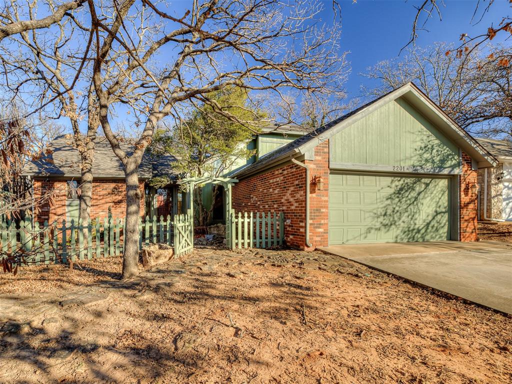 Welcome home to Chimney Hill, one of Edmond’s most beloved and established neighborhoods. This home features wood flooring, a vaulted ceiling, and a cozy wood-burning fireplace in the main living area. The primary bedroom is conveniently located on the first floor and offers built-in cabinetry for added storage.The kitchen includes solid countertops, an upgraded gas range, and a breakfast nook. Upstairs are two additional bedrooms and a full bathroom. Outside, enjoy a yard with mature trees and a sunroom just off the kitchen, providing additional living space year-round. As an added bonus, the home is near a trail that leads directly to Hafer Park, offering easy access to outdoor recreation.Schedule your showing TODAY - New Roof!