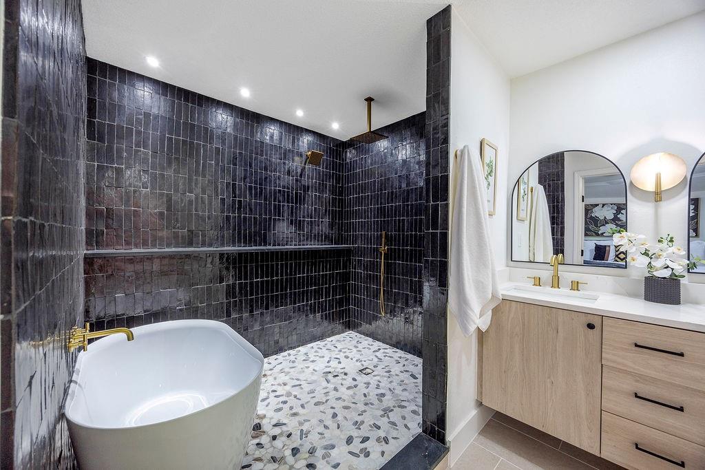 Experience modern luxury in this beautifully remodeled home, thoughtfully updated from top to bottom with designer style and attention to detail. Step inside to discover bright, open living spaces adorned with all-new designer lighting, elegant fixtures, and stunning tile work that flows seamlessly throughout. The show-stopping master suite features a spa-like bathroom with a luxurious wet room, custom tile design, and high-end finishes—your personal retreat for rest and relaxation. The kitchen and living areas are perfect for entertaining, offering a sleek, contemporary aesthetic and plenty of natural light. Outside, enjoy a private backyard oasis complete with premium turf for easy maintenance and year-round greenery. Every inch of this home reflects quality craftsmanship and sophisticated design—move-in ready and waiting for you to make it your own!