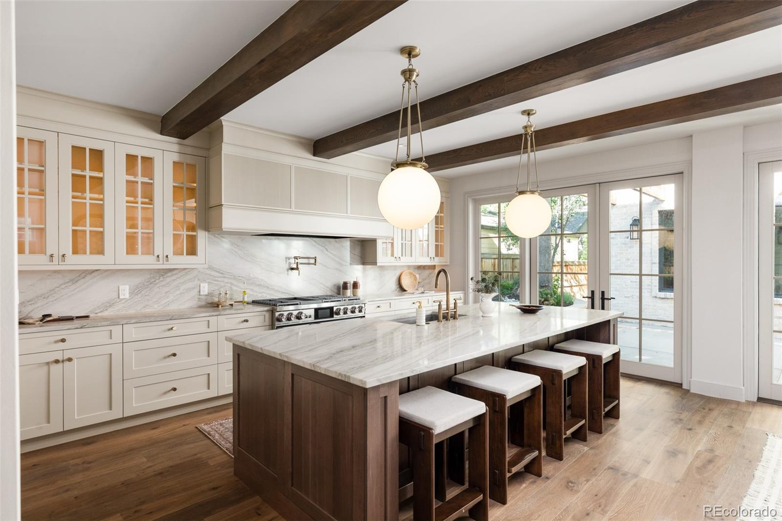 Introducing 1144 S Race-- a remarkable example of contemporary elegance, moments from Washington Park. Thoughtfully crafted by Definition Homes, this residence shines with entertainer’s touches. Towering ceilings and expansive windows create dimension and illumination within the main floor. Designer finishes, complementing the natural textures of a designer kitchen with luxury appliances, a massive center island and seamless access to a courtyard oasis with mature landscaping, a brick fireplace and fountain. An expansive primary suite emits a rejuvenating aura with a timeless, yet stylish en-suite bathroom complete with a walk-in closet, dual vanities and elevated features. Multiple balconies offer a stage for enjoying the outdoors while a lower level affords a sleek and moody entertainment space with a bar, gym and more. Steeped in the bright Wash Park locale and just blocks to retail like Devil's Food, Perdida, Bonnie brae Ice Cream, Reivers, Everything Little Thing and much more. This home is exemplary of Denver luxury.