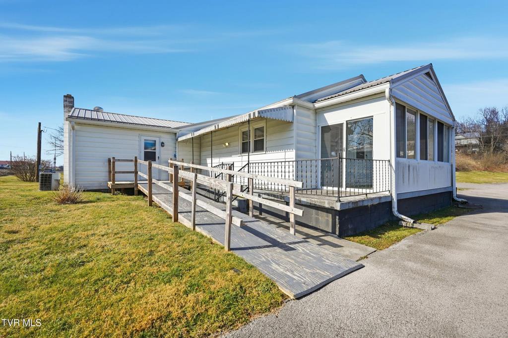 Charming 2-3 bedroom, 1-bath home full of original character and great natural flow. This property offers a solid layout that's ready to move in now, with plenty of opportunity to update and make it your own—perfect as a starter home or investment property. The floorplan is really versatile! Situated on 1.25 acres, the property includes a detached garage that could benefit from some updating. The acreage previously housed a mobile home, and existing hookups and capabilities may still be present; buyer or buyer's agent to verify. Additional highlights include a metal roof, appliances currently in the home are included, and ample outdoor space with future potential. The basement has excellent room for storage. There is an existing ramp on the back for easy access. Conveniently located near Bristol and Abingdon, with easy access to shopping, dining, and everyday amenities. A versatile property with character, land, and location—ready for its next chapter.