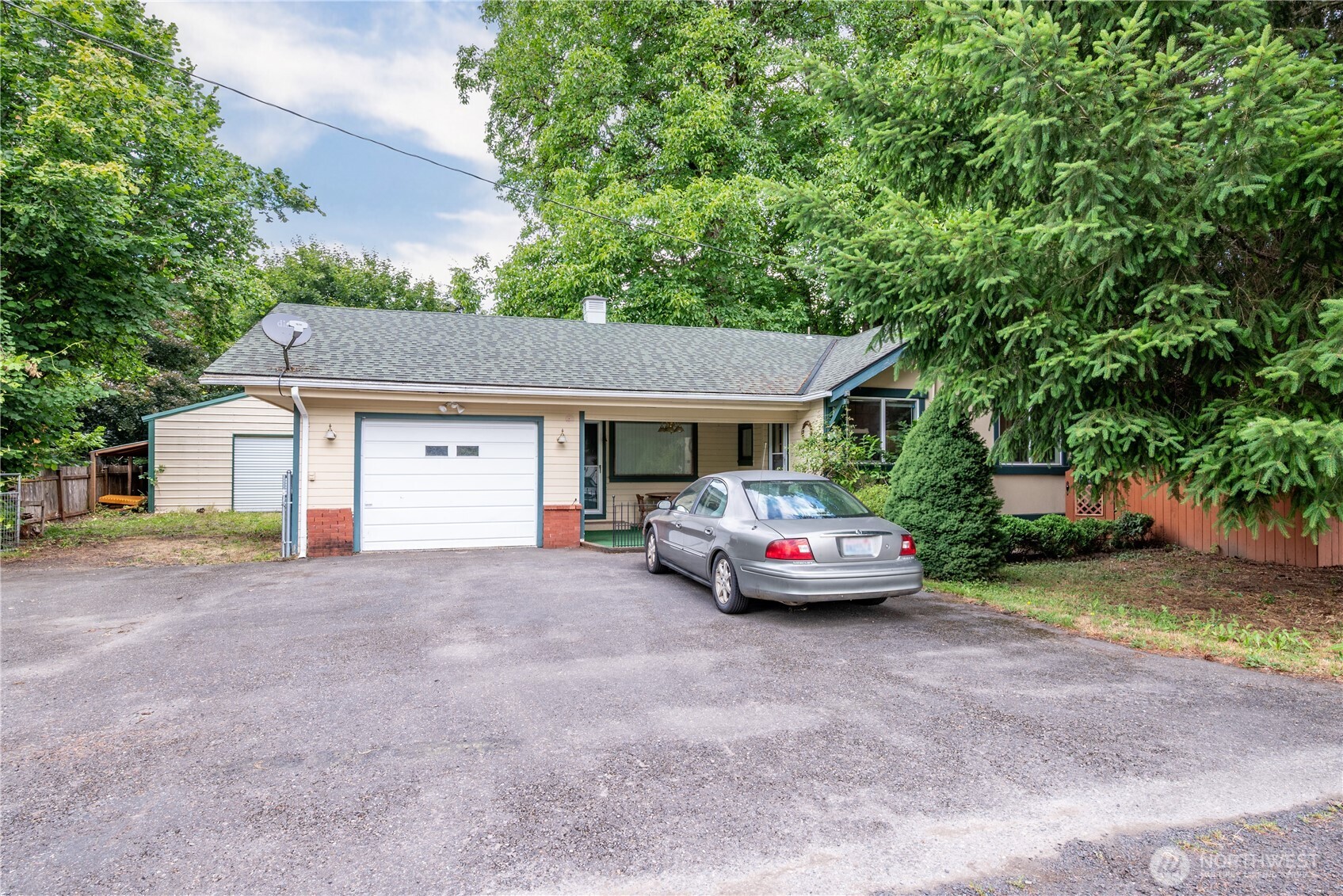 Tucked away in the quiet streets of Toledo awaits your new home! 3 Bedrooms, 1.75 Bathrooms, Large Kitchen w/ Eating Space, Sprawling Family Room with Wood Burning Fireplace spread across the main level. Partially finished basement offers Pantry/Cellar space, Bonus Room, Rec Area and Utility (Could be a basement apartment?). Covered patio for watching the sun go down or enjoying that first cup of coffee in the morning. Enormous gated Back Yard with mature Walnut trees, Shed/Studio, and 600sqft Shop with loft space. Front yard offers private fenced Court Yard, Flowers and paved driveway that leads to the Single Garage in front. Mature grapes are just about ready in the garden boxes and mature flowering plants surround the home. Back Deck lays under the tree canopy in the yard making it an ideal grilling and entertainment space to host your favorite guests or take in a sunny afternoon. This house is loaded with potential and waiting for you to make it HOME. Don’t miss this gem!
