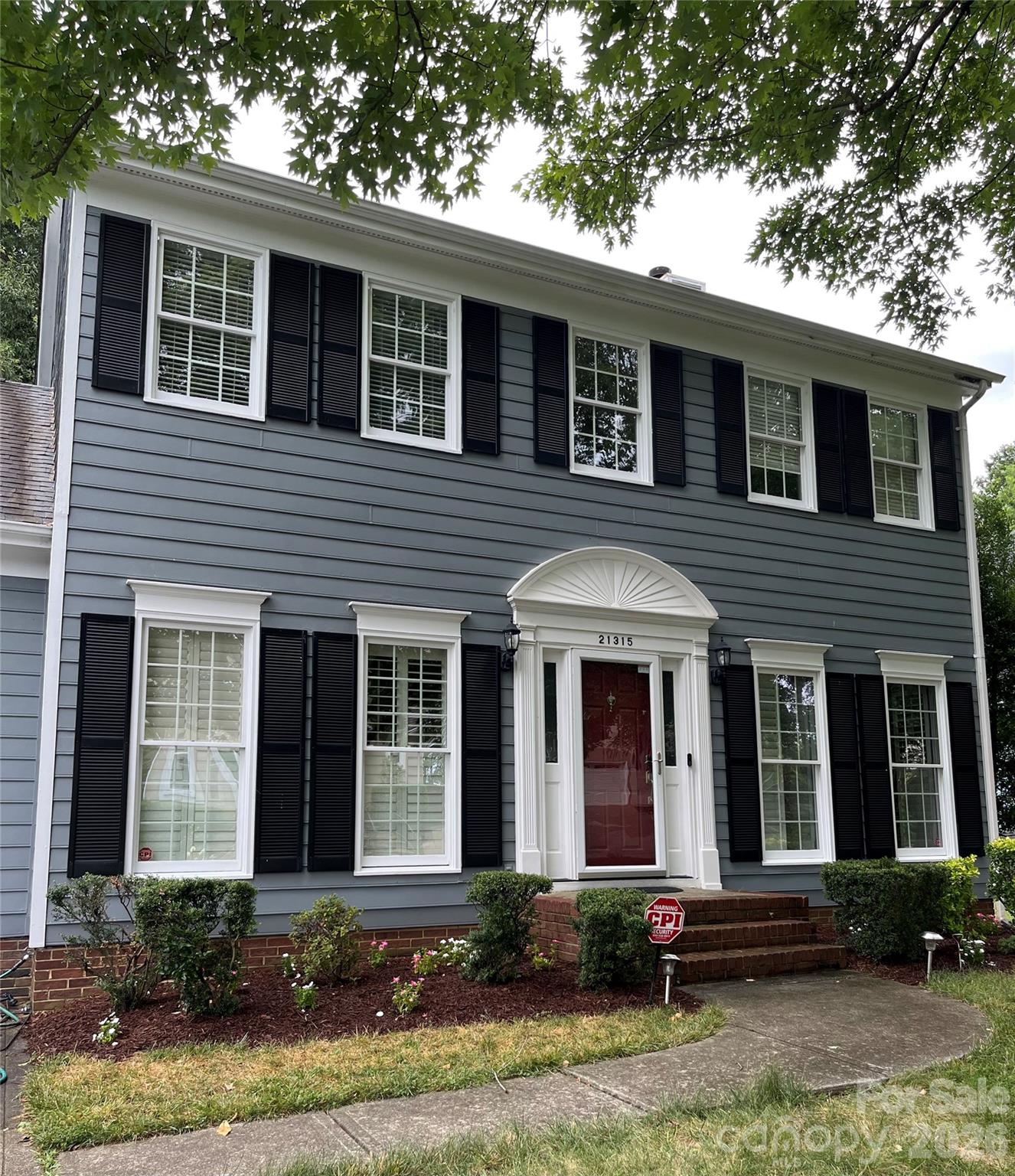 Experience the ease of lake living in this home in popular Blue Stone Harbor! The location of this home truly steals the show. Situated directly across from the community clubhouse, pool, and boat docks, you’re just a short trip from swimming, socializing, and setting sail from your very own deeded boat slip—all while enjoying a tranquil, year-round water view right from your home. This home is as close to water front as you can get without the waterfront pricing.Inside, the kitchen was smartly refreshed in 2023 with new cabinetry, easy-care quartz countertops, and new appliances—making meal prep a breeze. Meanwhile a pantry closet and a butler's pantry adds that extra bit of practical storage we all wish we had. The main level also features hardwood flooring, and a dedicated laundry room. Upstairs, the primary bedroom offers a comfortable retreat with a generous closet, while custom shelving keeps both the primary closet and pantry neatly organized.At just the right size, this home is all about low-maintenance living and maximum lake time.
