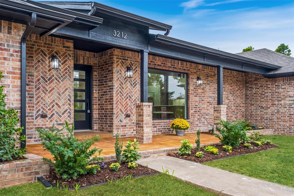 Discover the next level of complete renovation in this architecturally refined, single-level Edmond residence. Every surface, sightline, and finish has been reimagined to create a home that feels both timeless and completely new-a sophisticated interpretation of modern living wrapped in classic brick architecture. Behind the understated facade, a luminous open plan unfolds beneath vaulted ceilings with a warm wood beam and contemporary chandelier. Wide plank flooring grounds the space, while walls of windows draw the outdoors in, filling the living, dining and kitchen areas with natural light. The designer kitchen is a study in contrast and craftmanship-soft white cabinetry paired with natural wood accents, quartz surfaces, gold hardware and new appliances. A hidden butler's pantry expands functionality with custom shelving, open display space, and a built- in wine cooler. The primary suite evokes a spa-like serenity, anchored by a sculptural, oversized shower wrapped in dimensional tile and veined marble gold fixtures, Each secondary space continues the same meticulous attention to design, from the warm, paneled study with tray ceiling to the light-filled living areas that balance comfort and style. Outdoors, the covered patio offers a peaceful retreat beneath a dark-stained vaulted canopy, perfect for quiet evenings or easy entertaining. Set on a tree-lined street in one of Edmonds's established neighborhoods, this property offers the rare combination of classic form and cutting-edge finish. A true whole-home transformation, where craftsmanship meets design at every turn. Buyer to verify all information Sellers title work is completed at Chicago Title Nichols Hills