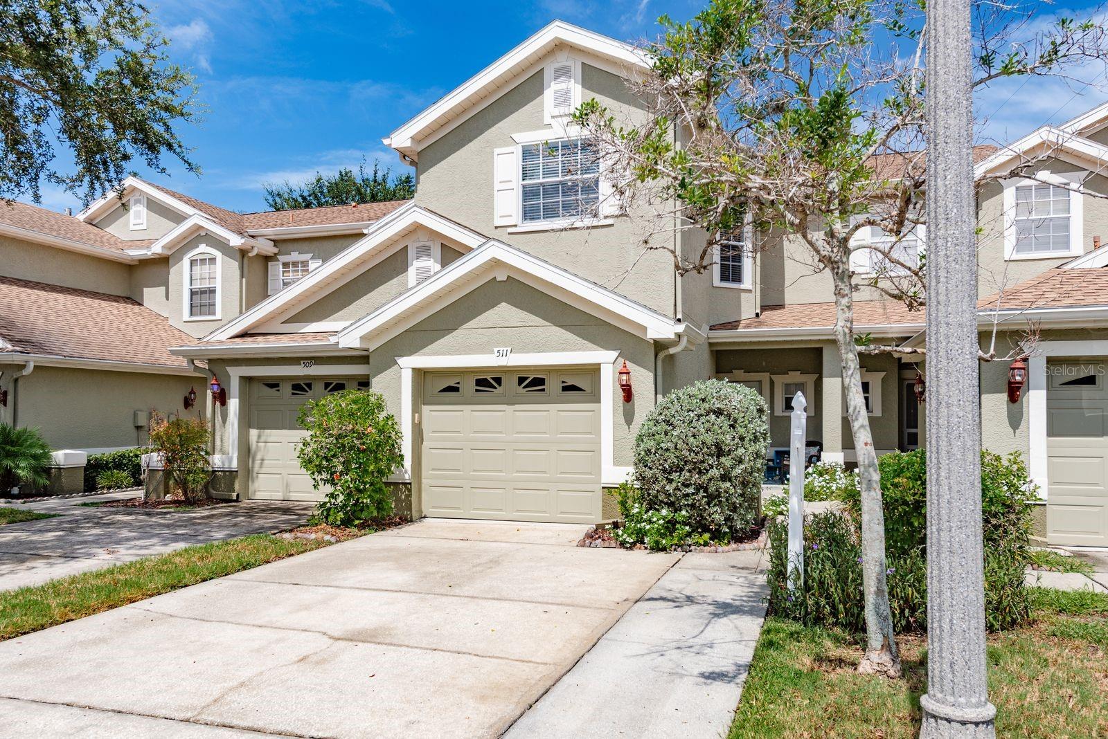 Completely Updated Townhome in Gated North Lake Community with Stunning Features & Prime Location! Welcome to The Townhomes at North Lake, a highly desirable gated community offering peace, security, and convenience just minutes from Tampa International and St. Pete/Clearwater airports, world-famous Sponge Docks, and the vibrant downtown Tarpon Springs scene filled with dining, music, art, and culture PLUS the very popular East Lake corridor for all the Golf and leisure one can handle! This immaculate 3-bedroom, 2.5-bath townhome is light, bright, and thoughtfully designed for everyday living and effortless entertaining. Enjoy consistent stunning stone countertops, custom cabinetry, and custom closet organizers in every room, including a charming third bedroom/home office complete with a custom built-in bookcase and walk-in closet. Upstairs, the massive master suite boasts soaring ceilings and a luxurious feel, while the convenient upstairs laundry keeps everything within reach. Step outside to your large concrete patio which is perfect for casual backyard barbecues, relaxing evenings, or entertaining guests in your bonus outdoor space. Love the outdoors? Right outside the gates is direct access to the PINELLAS TRAIL, where you can bike or walk to the Sponge Docks, charming downtown Tarpon Springs, and beyond — making it easy to enjoy all the area has to offer without ever getting in the car. Community amenities include a sparkling SALTWATER pool, serene lakefront dock and pier, and breathtaking views where wildlife and nature abound. Ideal for fishing or simply relaxing in this peaceful, quiet enclave. The low HOA covers major expenses such as roof maintenance, exterior painting, and more — making this a smart and low-stress investment. To top it off, the seller is including a full one-year Ultimate Plan Choice Home Warranty for added peace of mind. Don’t miss this turn-key opportunity to own a beautifully updated home in one of the area's best-kept secrets! Schedule your showing TODAY!!