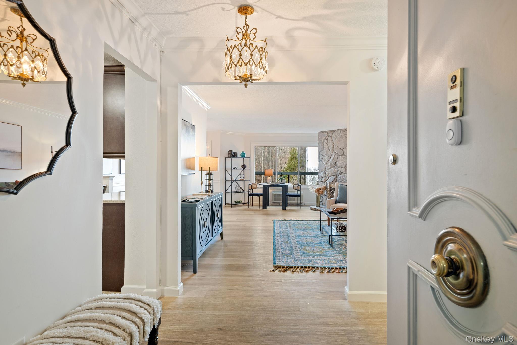 Welcome to High Point Condos in Hartsdale! This spacious and beautifully upgraded unit offers exceptional comfort and style, featuring a large living room with an open dining area, elegant crown moulding, and a cozy fireplace perfect for relaxing evenings. Enjoy treetop views from not one, but two private balconies, ideal for morning coffee or unwinding at the end of the day.The renovated kitchen boasts quartz countertops and modern finishes, while both bathrooms have been tastefully updated, including a private en-suite bathroom in the primary bedroom. With indoor parking, abundant closet space, and true move-in condition, this home offers convenience at every turn. Storage unit comes with the condo, perfect for extras.  High Point’s exceptional amenities include a full-service clubhouse, fitness center, saunas, outdoor pool, kiddie playground, and full-time security—all within a vibrant, impeccably kept community close to everything Hartsdale has to offer. Indoor, covered parking spot P3 - space 303. Storage unit #9 on P1.Located in a highly desirable community close to shopping, transportation, and amenities, this High Point condo blends comfort, style, and an unbeatable location. Don’t miss it! Assessment in the amount of $56,905.92 , you can choose to pay monthly over 15 years for $511.90, 12 months for $4,742.16 or fully pay off at closing.