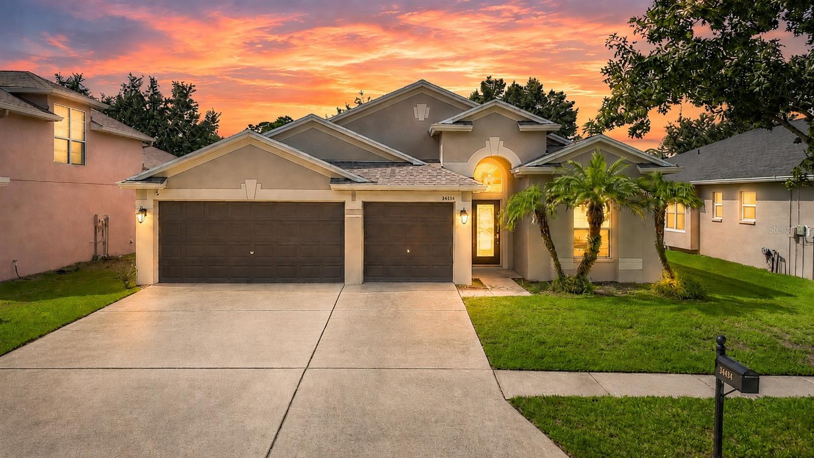 Step inside and discover a home designed for comfortable everyday living and easy entertaining! This inviting 4-bedroom, 2-bath home with a 3-car garage features a bright, open layout with high ceilings and flexible living spaces. The kitchen is the heart of the home, offering stainless steel appliances, new garbage disposal 2025, generous counter space, abundant cabinetry, and a spacious center island with breakfast-bar seating, opening naturally to the surrounding living and dining areas. The primary suite provides a relaxing retreat with dual sinks, a soaking tub, and a separate walk-in shower. Outside, enjoy the covered patio and fenced backyard, perfect for relaxing, entertaining, pets, or play. Beyond the home, enjoy a community designed for an active Florida lifestyle with a community pool, basketball court, scenic green spaces, and peaceful water views. With its spacious layout, desirable amenities, and valuable 3-car garage, this home offers a wonderful combination of comfort, convenience, and lifestyle. Don’t miss the opportunity to make this home yours. SCHEDULE YOUR SHOWING TODAY! ***Age of A/C inside- 1yr., Hot Water Heater - 1yr.