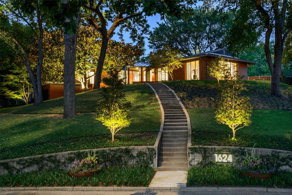 Perched high above the street on a breathtaking .75 acre elevated lot, this East Kessler gem commands sweeping views from nearly every room. The spacious lot has mature trees, new landscaping and outdoor lighting, multiple outdoor spaces, and a beautiful new water feature.Inside, the home has been renewed in almost every aspect. New and refinished wood flooring runs throughout, and the Level 4 drywall finish gives every room a crisp, gallery feel that’s perfect for art. The open kitchen is a hub for entertaining, connecting the living spaces to the outdoors.The main living room is spacious and built for gatherings, while a second living area, wrapped in flagstone, offers a more intimate place to relax. Floor-to-ceiling glass makes the entire home feel suspended in the trees.The primary suite is a calming retreat with a walk-in closet and spa bath with a soaking tub and separate shower. Two more bedrooms, one currently used as an office, share a well-appointed bath. An oversized two-car garage sits below, with separate space for a workshop or extra storage. The restored rear carport adds more parking and a private entrance to the fully fenced backyard. Additionally, the home has a newly installed metal roof, as well as an extensive list of upgrades completed by the current owners.Homes like this rarely come available in East Kessler!