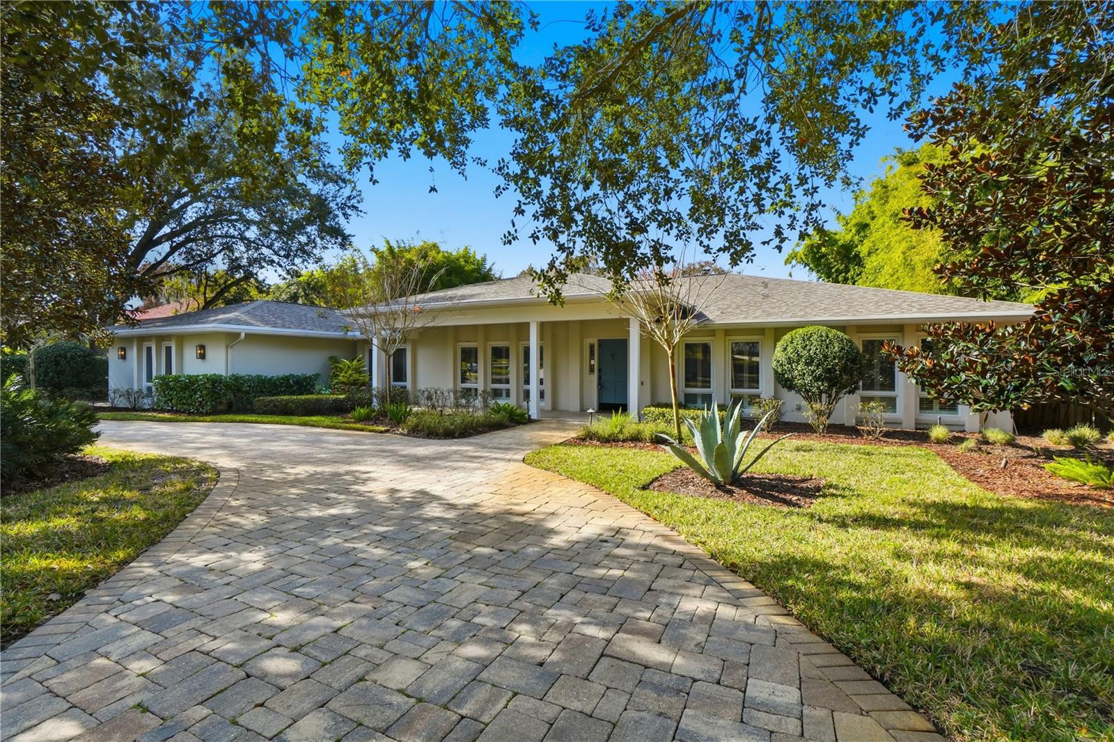 Walk in and feel instantly at home in this stunning 5-bedroom, 3-bath POOL home with a 3-car garage, offering over 3,600 square feet of living space on more than ¾ of an acre in the highly desirable Sevilla neighborhood of Winter Park. Backing directly to Howell Creek and Mead Gardens, this property offers the rare luxury of no rear neighbors and exceptional privacy. Upon entry, you’re welcomed by beautiful wood floors and versatile spaces to the left that can serve as a formal living room, dining room, office, or playroom. Continue into the impressive family room, featuring vaulted ceilings, skylights, and a wood-burning fireplace, creating a light-filled and inviting atmosphere. To the right wing of the home are four bedrooms and two bathrooms, including the primary suite. One secondary bedroom connects to the primary, making it ideal for a nursery, home office, or sitting room. The spacious primary retreat offers large walk-in closets, dual vanities, a soaking tub, separate shower, and French doors that open directly to the pool and backyard oasis. The kitchen, located just off the family room, features travertine flooring and flows seamlessly into a huge pantry, oversized laundry room, drop zone, and a second primary suite with ensuite bath—perfect for guests or multigenerational living. Outside, the home has been meticulously maintained, showcasing a new roof (2023), exterior paint (2018), pavered circular driveway, well, and lush tropical landscaping that enhances the home’s curb appeal. Additional features include a three-car side-entry garage, pool heater, designer lighting, engineered hardwood floors, and crown molding throughout. Located within the highly sought-after Winter Park School District (Audubon K-8 and Winter Park High School) and just minutes from Park Avenue, Central Park, Rollins College, SunRail, the Winter Park Farmer’s Market, and world-class shopping and dining. Schedule your private showing today—this exceptional home won’t last long!