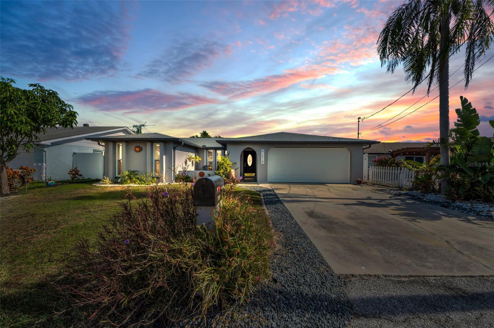 WOW DON'T MISS THIS BEAUTIFUL HOME!!!!! This three-bedroom, two-bathroom house offers the perfect opportunity for waterfront living. The property features a floating dock, stationary dock, and a 12,500-pound boat lift, making it an ideal choice for water enthusiasts. Enjoy the tranquility of kayaking, boating, fishing and island hopping right from your backyard. The property is golf cart-friendly, and multiple waterfront dining options are just minutes away. Enjoy your favorite beverage and watch the spectacular sunsets on Hudson Beach.The completely renovated, move-in-ready home boasts a split-bedroom layout for privacy, ceramic tile throughout, and a full two-car garage. The kitchen is equipped with quartz countertops and stainless-steel appliances, perfect for preparing your fresh catch. The fenced-in backyard offers stunning waterfront views and opportunities to watch seabirds soar and spot dolphins and manatees.Situated on a wide, deep-water canal with direct Gulf access and no bridges, this property is sailboat-friendly and just five minutes from the open Gulf, where world-class fishing, scalloping, and stone crab harvesting await. Whether you're looking for a full-time residence, a winter retreat, or an investment opportunity, this Florida dream home is an ideal choice for those seeking a truly immersive waterfront lifestyle. Schedule your private tour today!