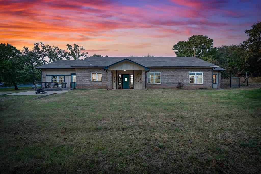 Set on 5 wooded acres at the end of a cul-de-sac in Norman, this spacious ranch-style property offers 3,100 square feet of versatile living space with room to spread out, entertain, and enjoy the outdoors. The single-story home features 4 bedrooms, 3 full bathrooms, two living areas, and two dining areas, providing flexibility for a variety of needs. The inviting living room features built-ins and a gas-log fireplace, while the kitchen offers built-in features, a pantry, and an adjoining eating area. A bonus room, optional additional bedroom, and workshop provide even more possibilities for work, hobbies, or additional living space. Recent improvements include a kitchen renovation in 2026, a French drain installed in 2026, a water heater replaced in 2025, and a composition roof from 2022. Outside, enjoy the privacy of a wooded 5-acre property with partial fencing, space for livestock, and convenient access to Lake Thunderbird. A detached carport, additional gravel parking, and a dedicated laundry room add everyday functionality. Located in the Norman Public School District, this property combines generous interior space, meaningful improvements, and a rural setting with room to make it your own. Don't miss out on the acreage, flexible floor plan, and recent improvements that make this property stand out. Come see how much space and potential await at Lago Ranchero.