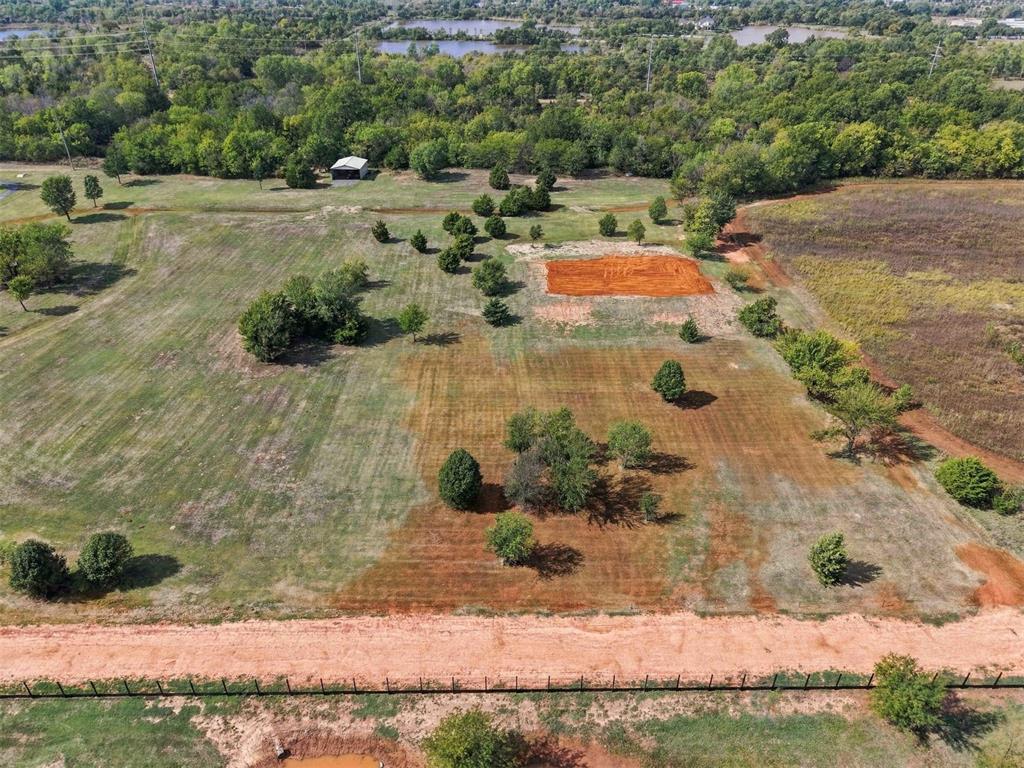 Looking for the perfect place to build your dream home? Discover approximately 5 beautiful acres situated at the northwest corner of SW 157th Street and S. St. Clair Avenue in Cleveland County. This beautiful property has been meticulously cared for and thoughtfully maintained, with attention given to enhancing the land and preserving its mature trees, creating an inviting setting for your future home. Zoned residential/agricultural, the property offers plenty of room for a custom home, shop, garden, or outdoor living space. A water association meter is already installed, electricity is available nearby, and natural gas is available. Enjoy the peaceful atmosphere of country living while remaining conveniently located near May Avenue, Moore, and south Oklahoma City. Bring your vision and explore the possibilities this exceptional acreage has to offer!