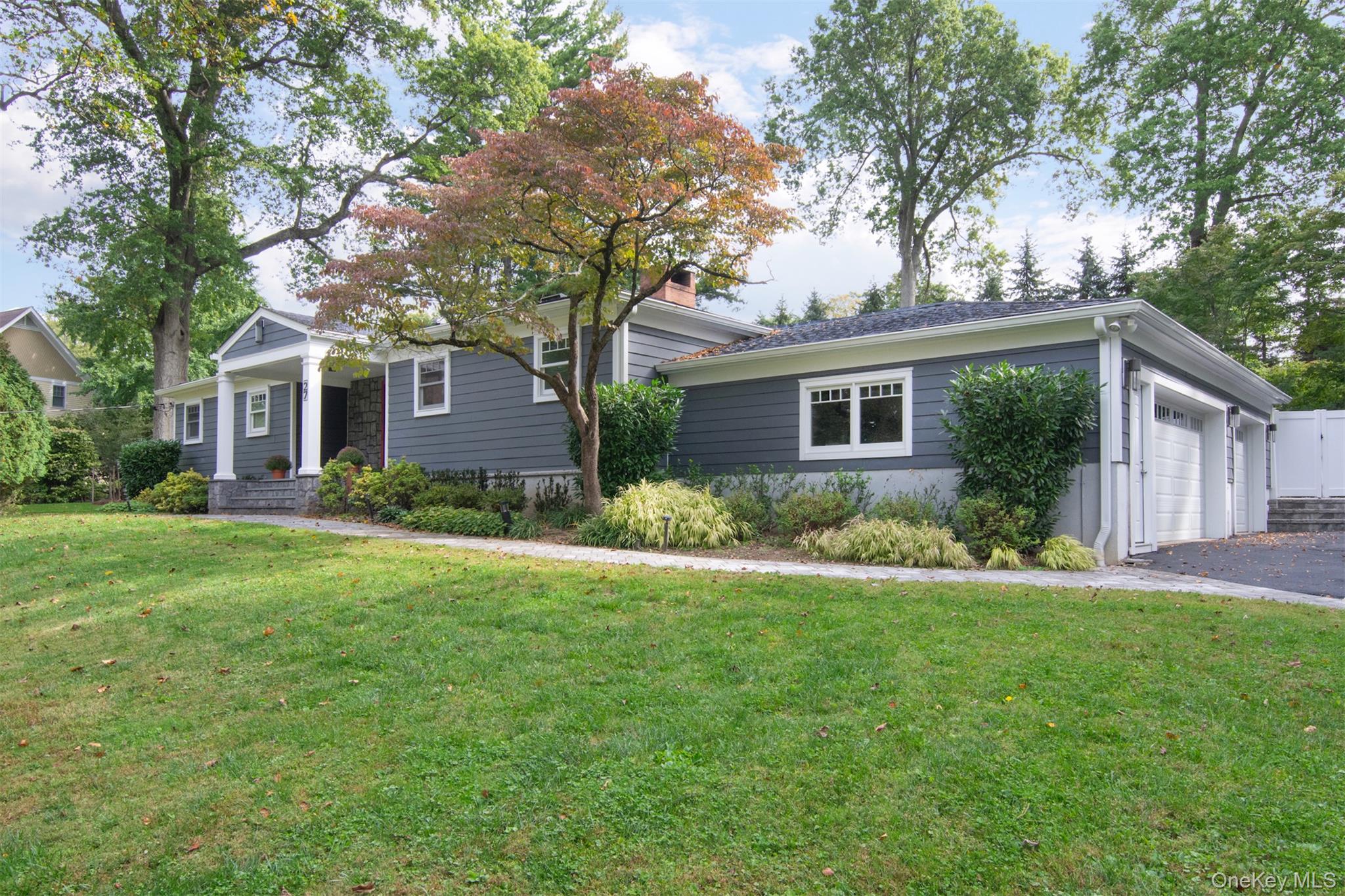 Rebuilt Modern Ranch available in Hartsdale Estates. Move right in to this beautifully reimagined and rebuilt modern Ranch offering the perfect balance of luxury, comfort, and functionality. Set on nearly an acre in desirable Hartsdale Estates, this single-level home features a bright open floor plan with white oak floors and oversized windows that fill the interior with natural light. A stunning three-sided gas fireplace connects the spacious living and dining areas to a chef’s kitchen equipped with Thermador and Fisher & Paykel appliances — ideal for entertaining. The private bedroom wing includes three generous bedrooms, two full baths, and a laundry area. The expansive primary suite features a spa-like bath with heated floors, soaking tub, walk-in shower, custom walk-in closet, and flexible space for a sitting area, home office, or gym. The finished lower level offers a large recreation room, media space, or playroom with plenty of storage and the option to add a fifth bedroom and bath. Enjoy outdoor living with a heated Gunite pool, full outdoor bath/dressing room, and a fully fenced yard. A three-car attached garage completes this move-in-ready home.