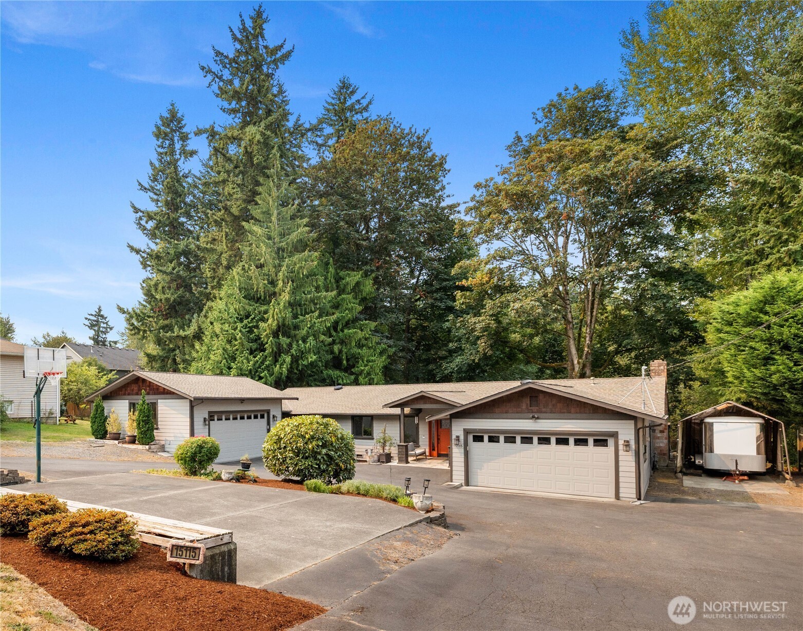 A rare opportunity awaits in Kenmore! This sprawling 3060 sqft rambler sits on a private 1.3+ acre lot in the acclaimed Northshore School District. Offering a spacious layout with 3 bedrooms and 4 bathrooms, this home blends timeless design with modern appeal. While originally built in 1989, an extensive remodel provides an effective year built of 2006. You’ll find unmatched convenience with two separate attached garages and dedicated RV parking with full power/dump hookups. The expansive property also presents a fantastic opportunity for a DADU for guests or rental income. Stay comfortable with central A/C and a newer gas furnace. This property offers a perfect blend of privacy, possibility, and a premier location.