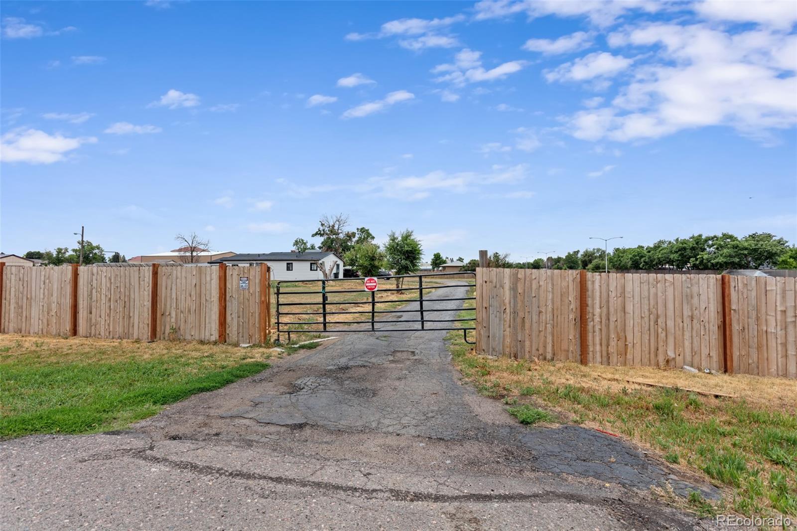 Discover an incredibly rare opportunity at 1280 Airport Blvd in Aurora! This nearly 2-acre property offers the best of both worlds: a functional, off-grid horse setup within city limits. Thanks to its grandfathered Agricultural zoning, you'll enjoy massive potential that's truly unique.

This property boasts a fully paid-off solar panel system and a private, capped well, complemented by city sewer and water connections. Horse enthusiasts will be thrilled with the sheltered 4-stall stable, detached 2-stall stable, and fenced riding area with expansion potential. There are also three large outbuildings for storage, along with detached two-car and attached one-car garages.

While the house, which includes an attached sunroom, needs a remodel, its long-term value is undeniable. Enjoy miles of horse trails right at the end of the street and NO HOA!