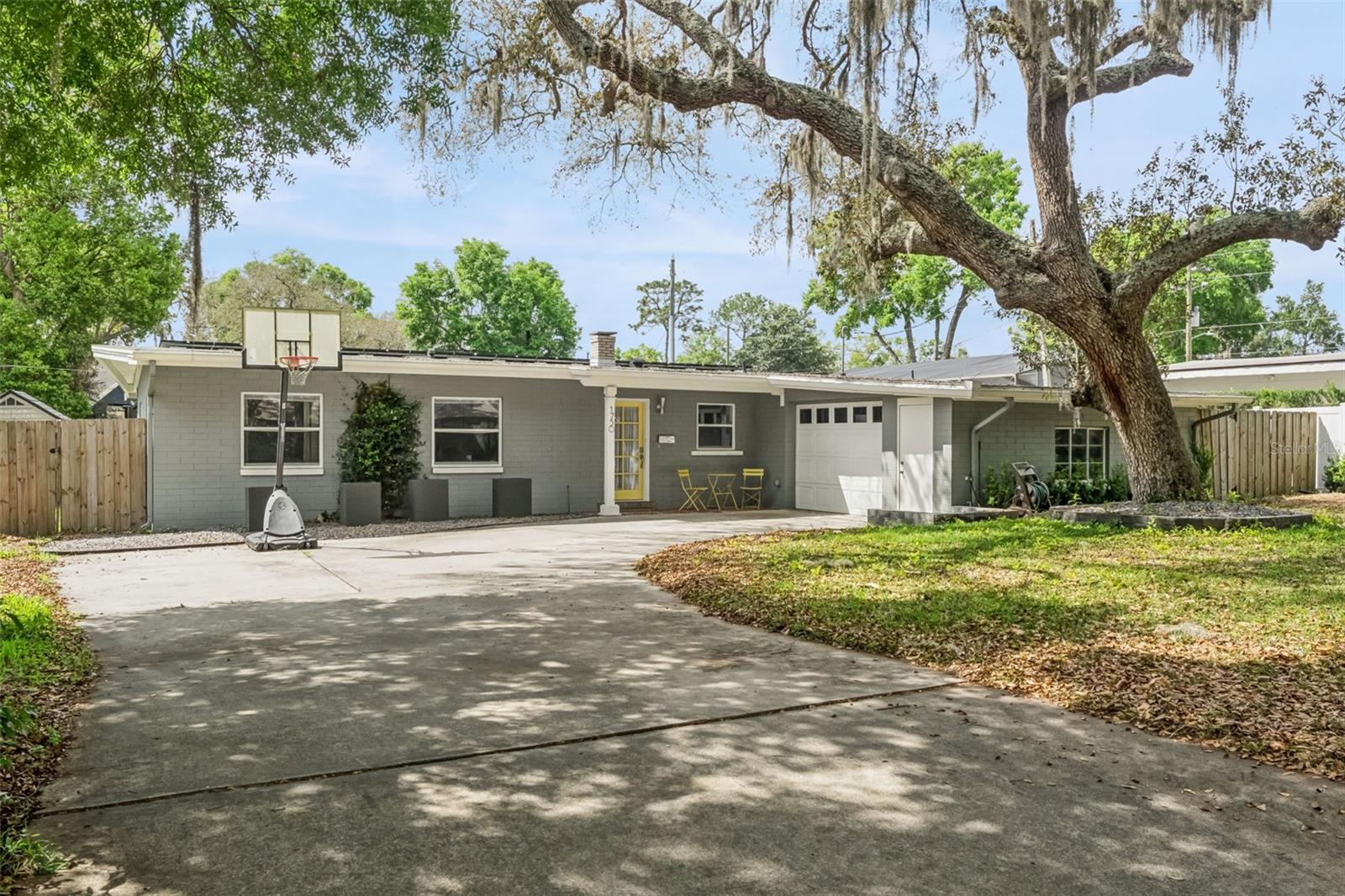 Set along a quiet, tree-lined street in Maitland, this 3 bedroom, 2 bathroom home with 1,922 square feet captures the essence of mid-century modern design with a fresh, updated edge. Clean lines, open flow, and a strong connection to the outdoors define the home from the moment you step inside.The living spaces feel intentional and uncluttered, with natural light highlighting the architectural simplicity that makes this style so enduring. An updated kitchen anchors the home with modern finishes and functionality, complemented by an eat-in dining area that invites everyday gathering. A dedicated bar area adds character and ease for entertaining, creating a space that feels both relaxed and refined.A separate office/flex space provides flexibility for today’s lifestyle, offering a quiet place to work or create without disrupting the flow of the home. Updated bathrooms carry a cohesive, minimalist design throughout, staying true to the home’s architectural roots.The outdoor space continues the story. Minimalist landscaping and open, usable areas create a calm and private setting that feels like a natural extension of the interior. It is a setting designed for both quiet mornings and easy evenings with friends.An optional HOA provides deeded lake access, adding a lifestyle component that is increasingly hard to find. All of this is paired with access to some of the most highly regarded schools in Central Florida and a location just minutes from Park Avenue, dining, and shopping.This is not just a home with style. It is a home with intention.