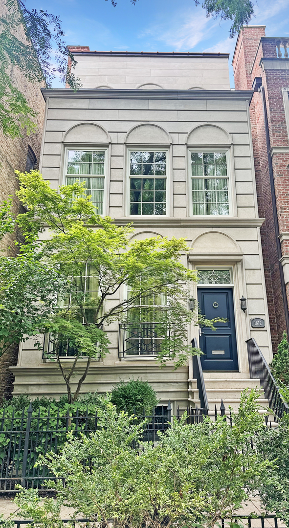 This limestone and brick stunner in the heart of East Lincoln Park offers approx. 6,200 sqft of thoughtfully designed living space, timeless finishes, and an ideal floor plan for modern living. Featuring 6 bedrooms and 5.2 baths, the home blends classic elegance with modern functionality.  The first floor welcomes you with a spacious formal living and dining room, flowing seamlessly into the gourmet kitchen with pantry, breakfast area, and a large family room that opens directly to your private backyard courtyard-perfect for grilling, entertaining, and everyday enjoyment.  The next two floors offer four oversized bedrooms, each with ensuite baths and beautifully built-out closets. You'll also find a flexible family lounge or playroom-perfect for a kids' level or additional hangout space..  The versatile lower level features a private entrance, making it ideal as an in-law suite or guest quarters. This floor also includes a home gym and an additional family room, offering even more space to relax or entertain.  High ceilings, large rooms, and abundant natural light enhance the home's elegant feel, while a rooftop deck delivers panoramic skyline views. Complete with a 2-car attached garage, this home is ideally situated on a tree-lined street in the coveted Lincoln School district and steps from all the best of East Lincoln Park.